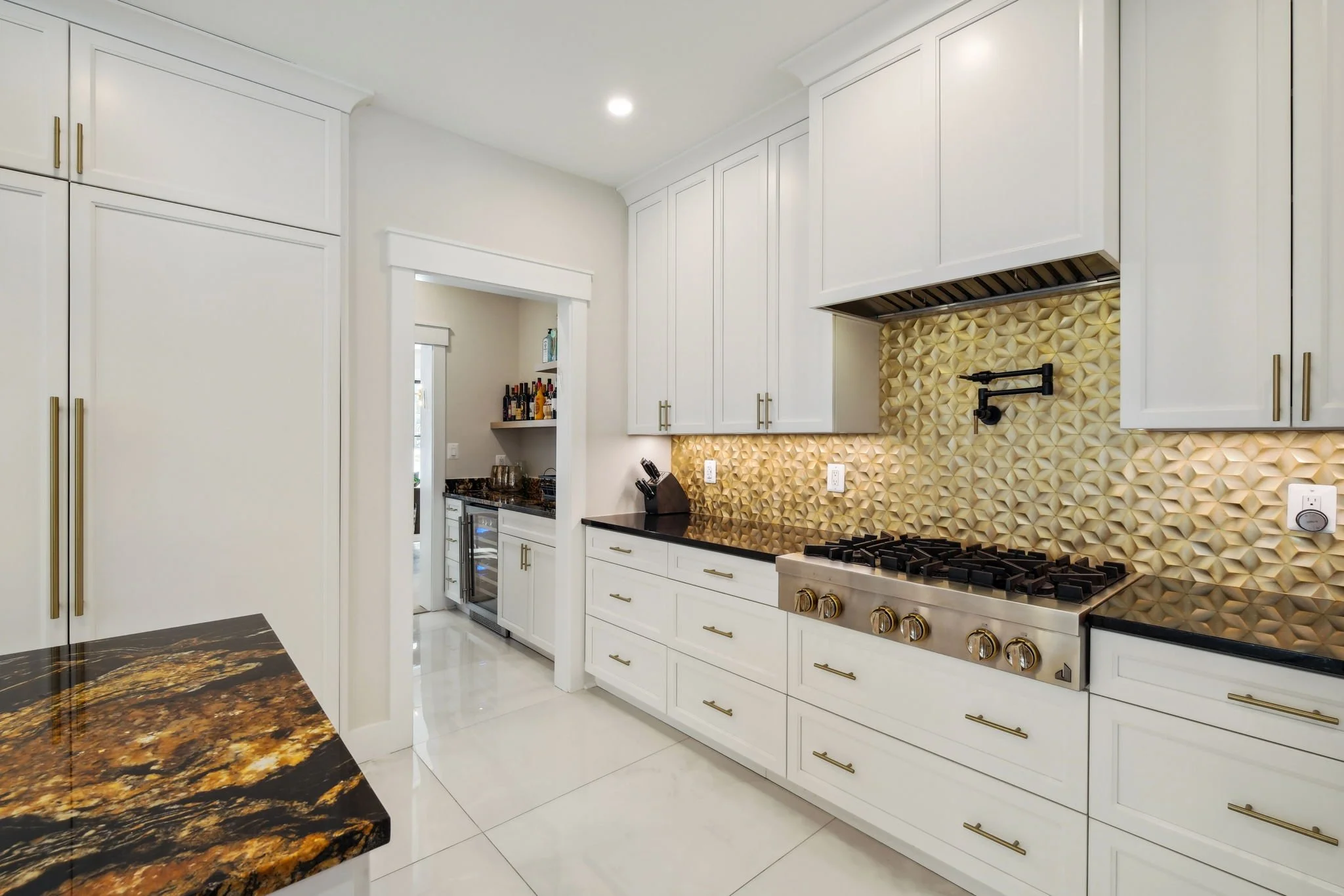 Back Kitchen wall with high end range top, pot filler, 30 inch freezer, 30 inch refrigerator  