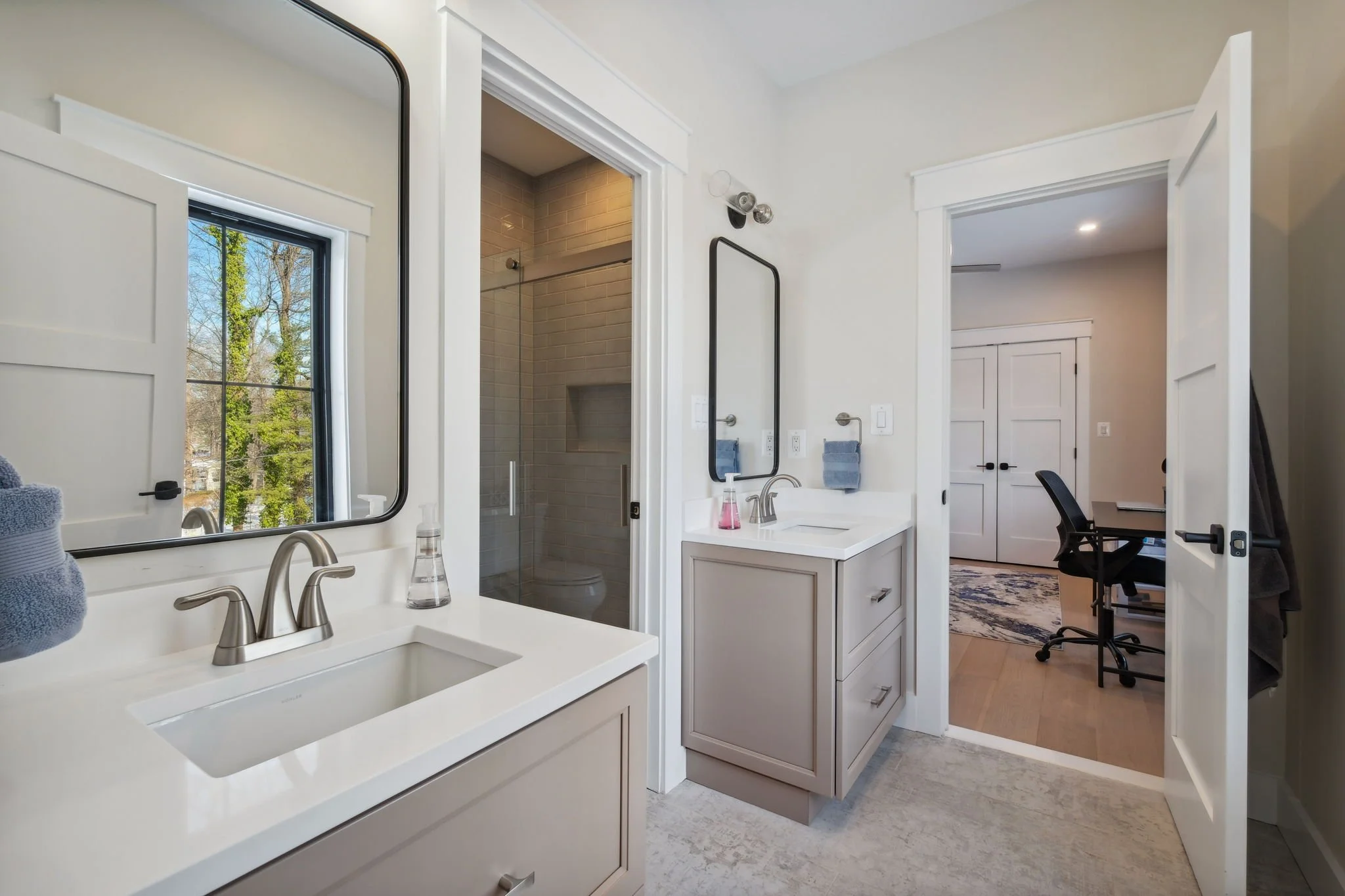 Jack and Jill Bathroom with beige tones and a light blue tile floor