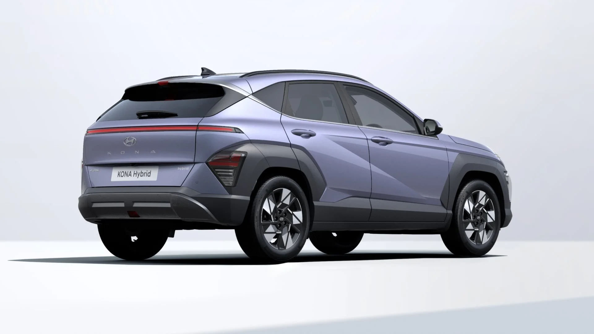 A silver Hyundai Kona Hybrid SUV car on a white background.