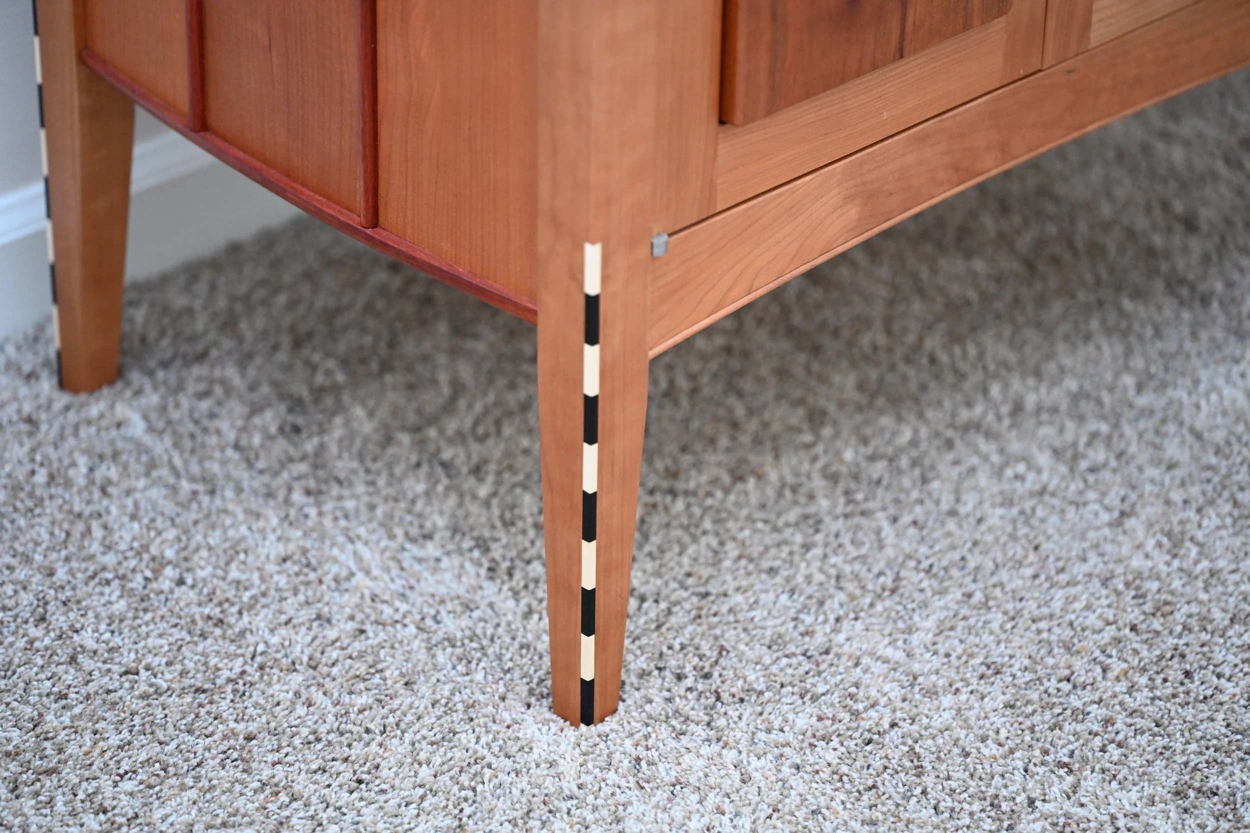 Close-up of ebony and holly inlays.