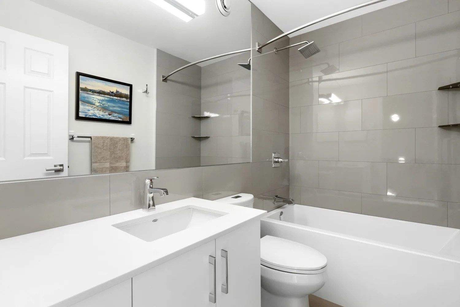 Bright, modern bathroom with a new glass shower