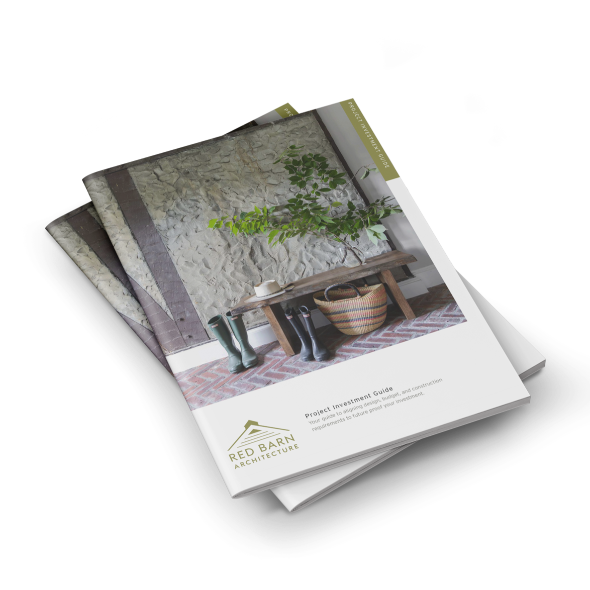 Stack of architecture project investment guides from Red Barn Architecture featuring a photo of a rustic interior with a stone wall, wooden bench, green plant, and rain boots.