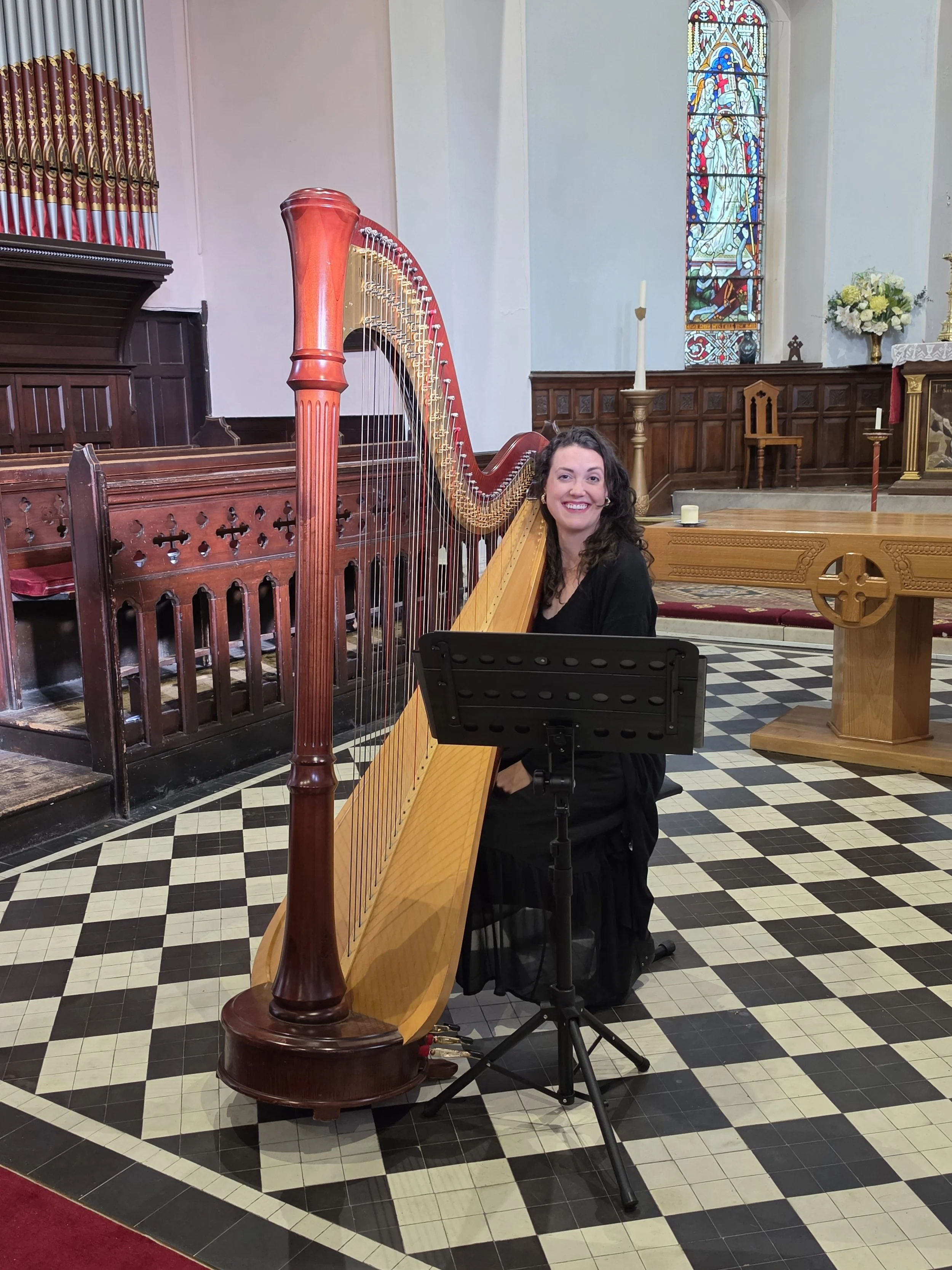 Elizabeth Veal, our harpist, at St. Paul's Church in Ramsey, Isle of Man.