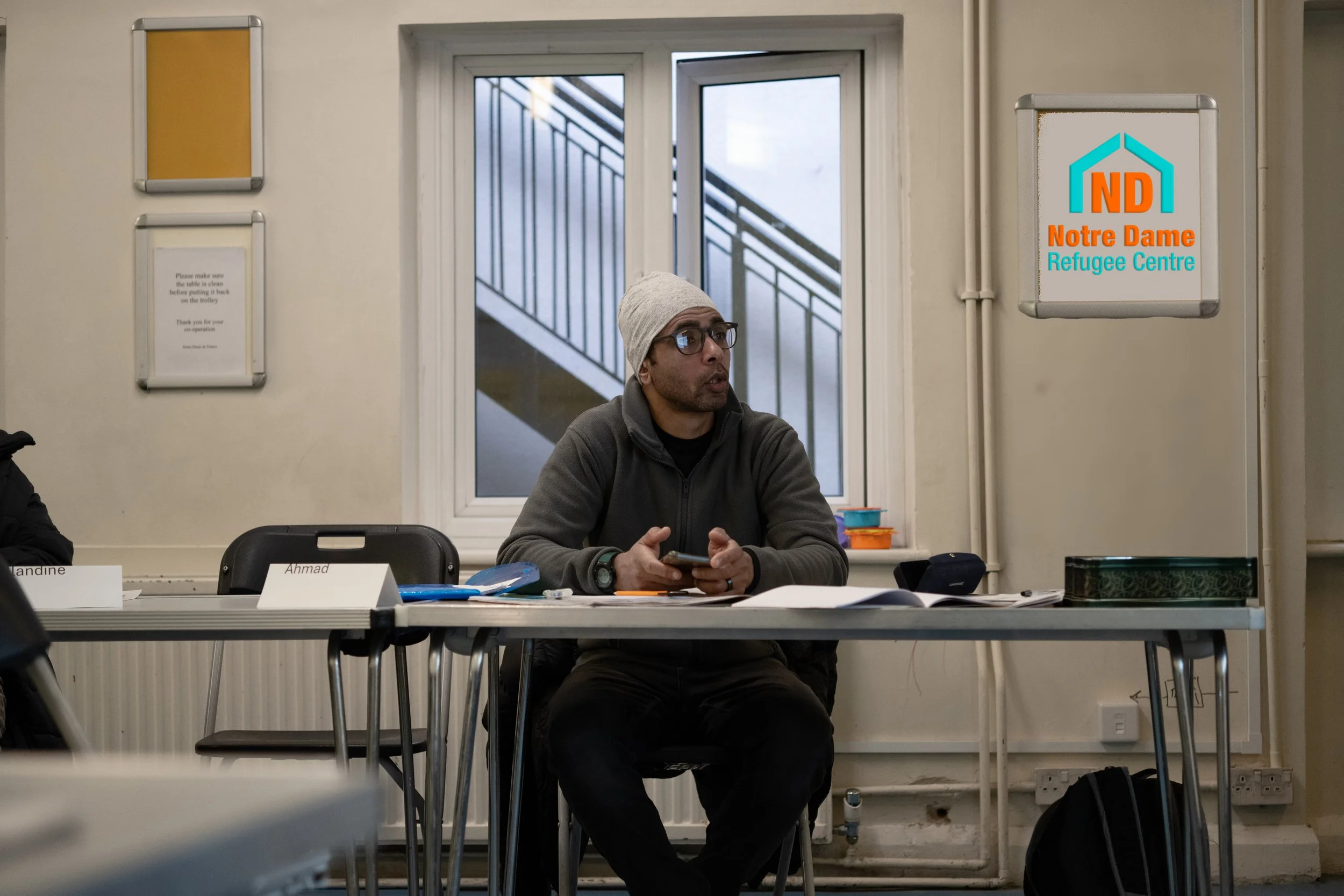 notre-dame-refugee-centre-man-at-desk-learning copy.jpg