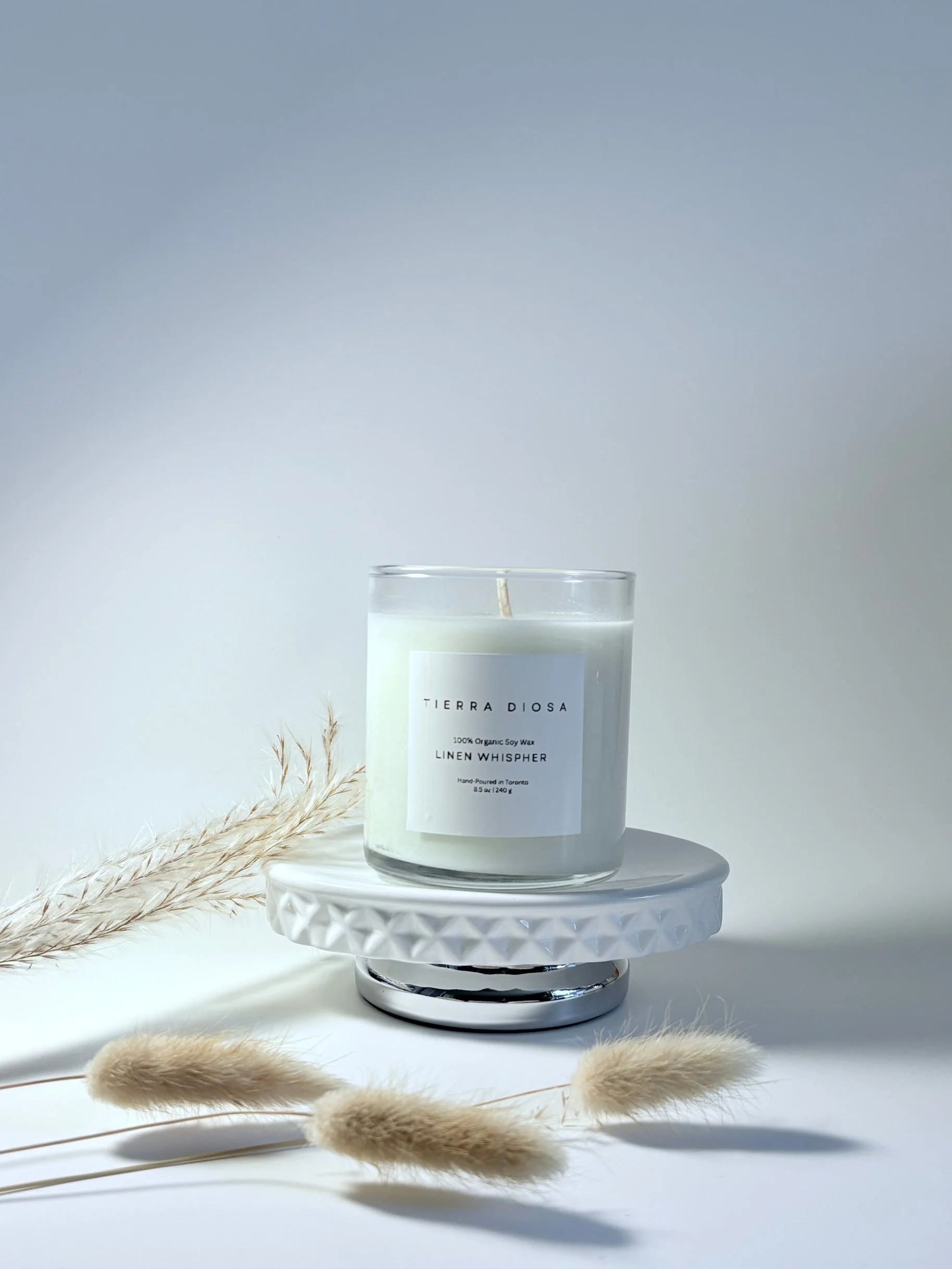 Discover Tierra Diosa’s Essence Petite (4oz) & Signature Glass (8.5oz) soy candles in Linen Whisper, Solstice Citrus, Ethereal Calm & Vanille Tahitienne.