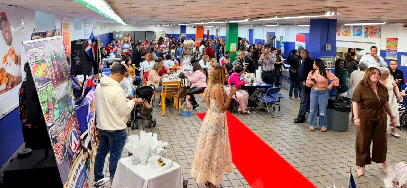 Woman giving a speech in a crowded room full of people.