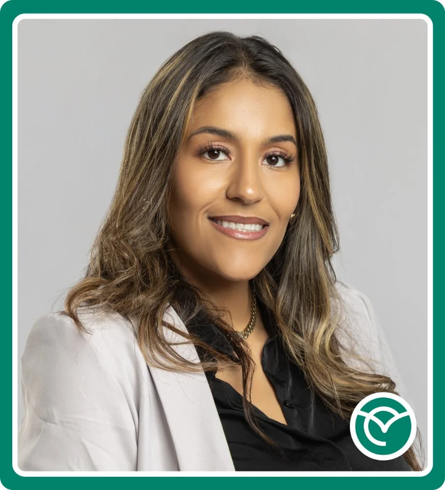 Photo of a professional woman wearing a suit jacket