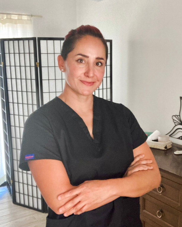 Massage therapist in a professional uniform