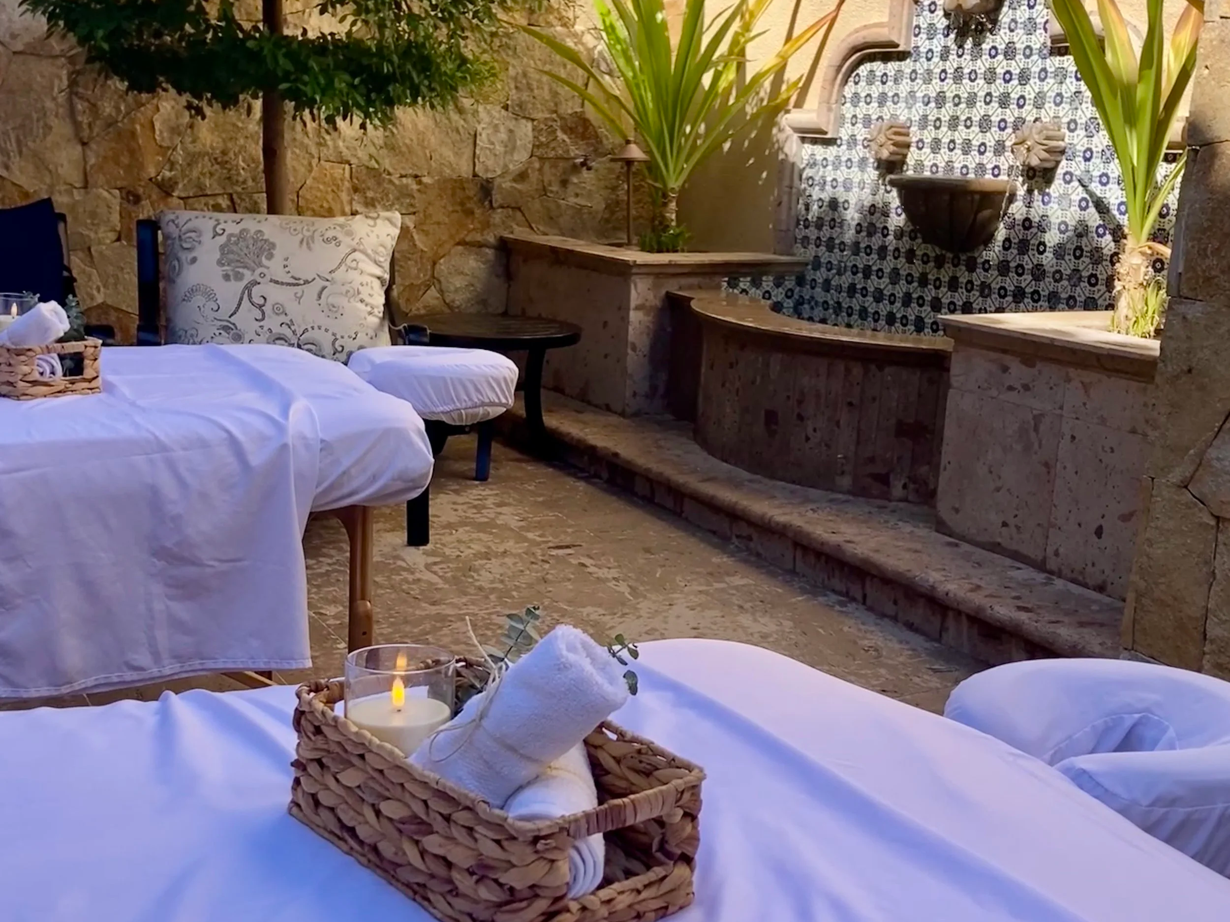 Professional massage table prepared with fresh linens and towels in Los Cabos