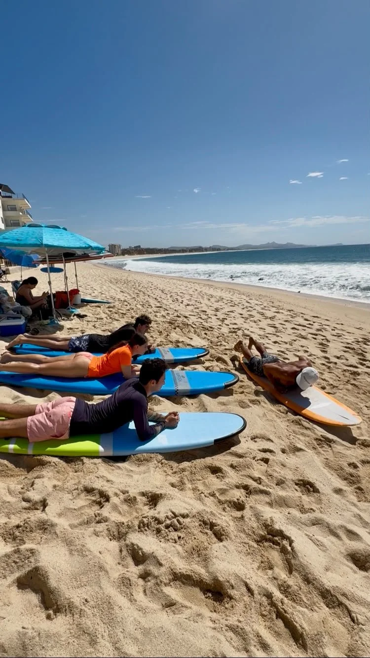 Surf lesson on a beach in Los Cabos