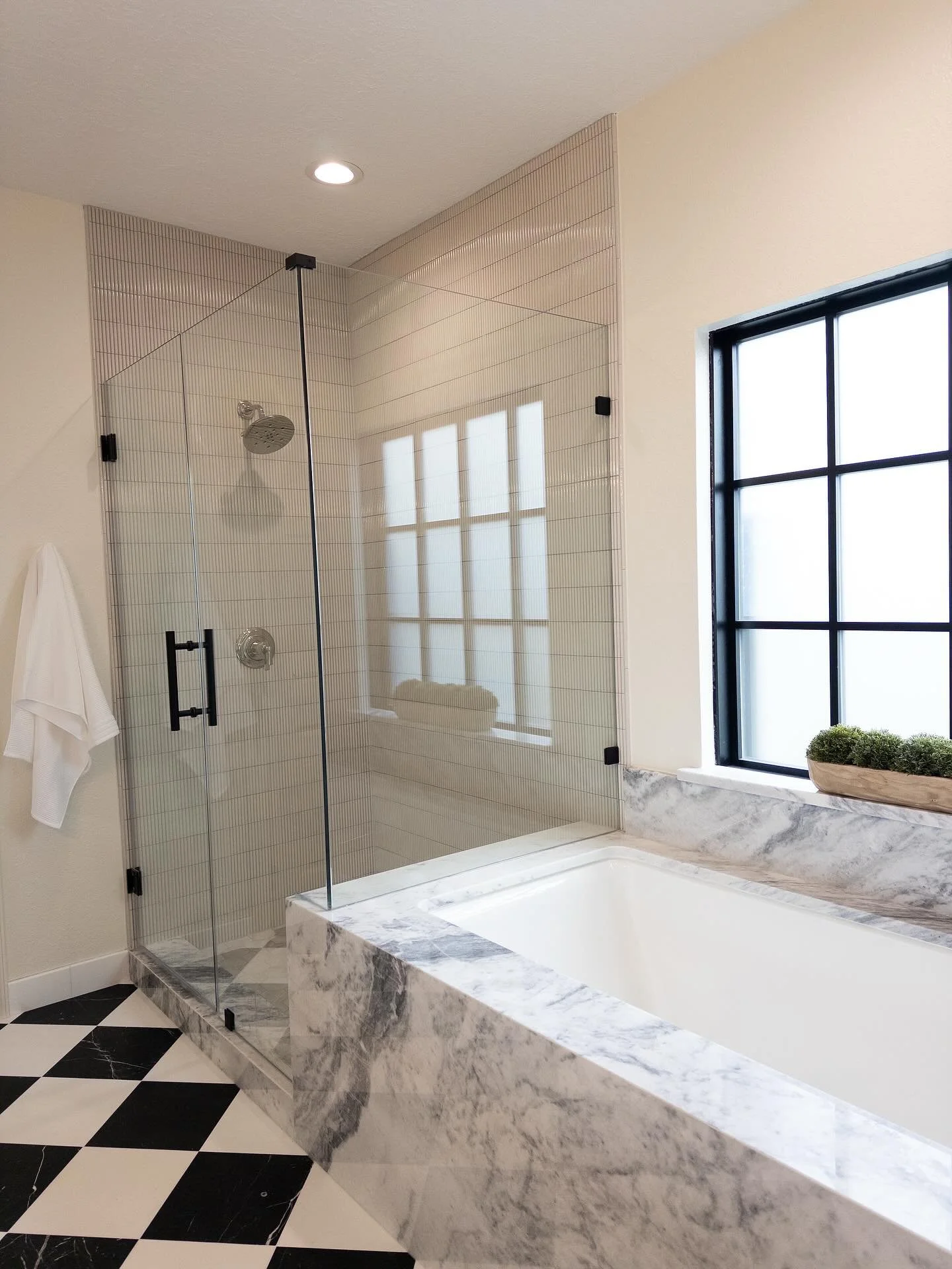 Black + white checkered floors, a marble-wrapped under-mount tub, and hand-crafted shower tiles &mdash; every detail designed with intention.

When we say custom home, we mean it. At GEMS Custom Homes, we take your vision and turn it into reality. 

