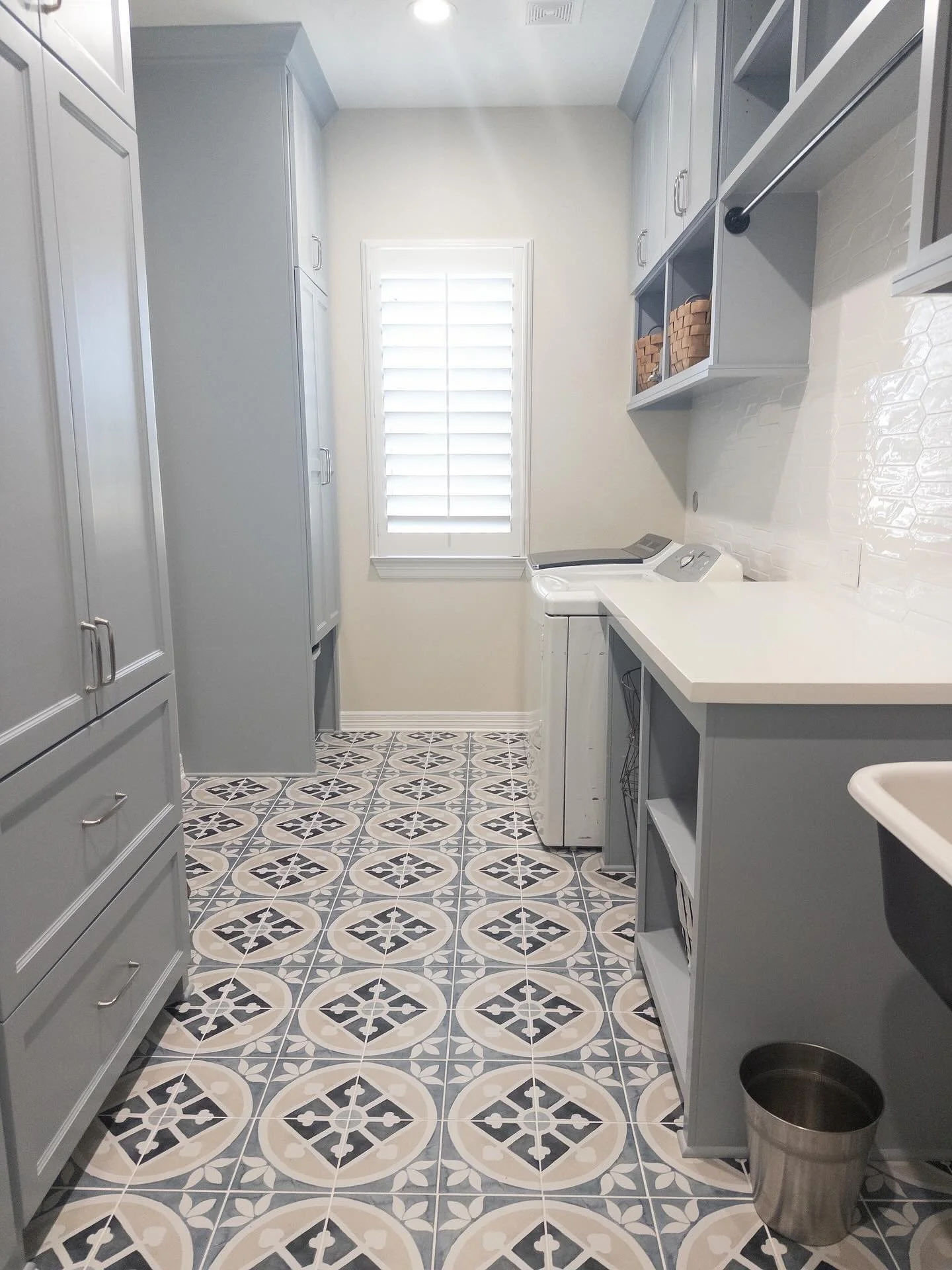 Laundry rooms deserve just as much personality as the rest of your home! Trend alert &mdash; patterned floors and soft blue cabinetry are not going out of style anytime soon. 💙
Let&rsquo;s be honest, we spend enough time in here &mdash; might as wel