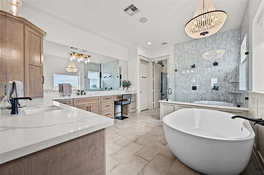 A bathroom retreat that feels like pure luxury. From the freestanding tub to the chandelier details, every corner was designed with comfort + elegance in mind.

At GEMS Custom Homes, we don&rsquo;t just build houses&mdash;we create spaces you&rsquo;l