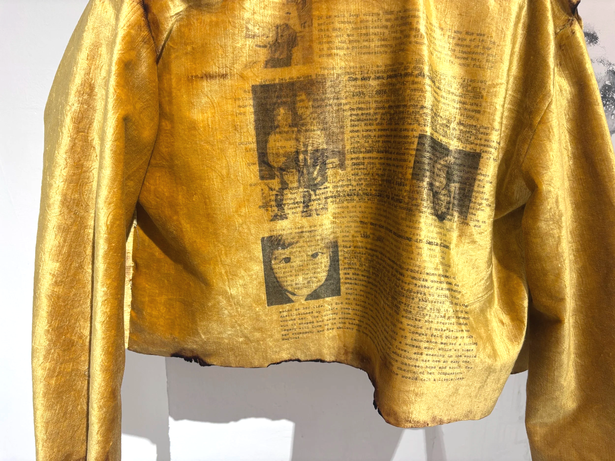 Coat of Grief No. 1 (details)
Upcycled theater curtain, thread, yarn, chicken wire, DTG-printed fabric, and handwritten obituaries for past versions of myself that I've grieved, lighter
30 x 24 x 6 in
2026