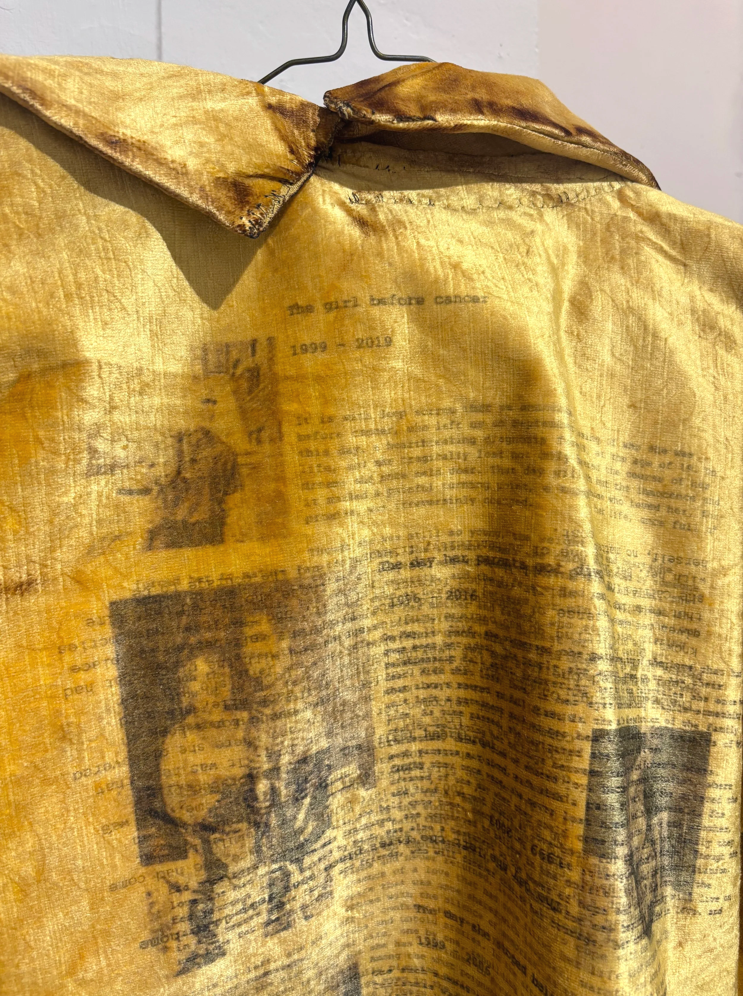 Coat of Grief No. 1  (details)
Upcycled theater curtain, thread, yarn, chicken wire, DTG-printed fabric, and handwritten obituaries for past versions of myself that I've grieved, lighter
30 x 24 x 6 in
2026