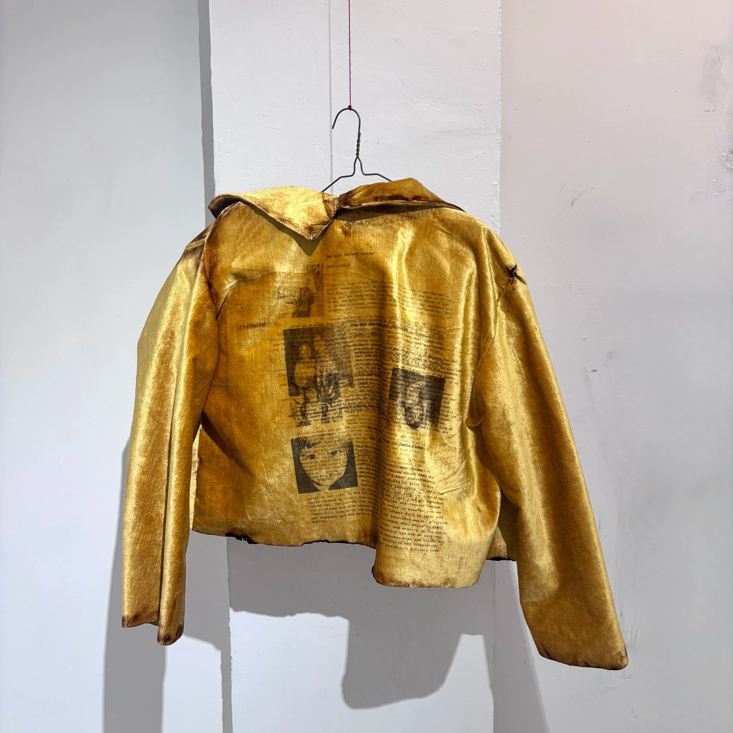 Coat of Grief No. 1 
Upcycled theater curtain, thread, yarn, chicken wire, DTG-printed fabric, and handwritten obituaries for past versions of myself that I've grieved, lighter
30 x 24 x 6 in
2026