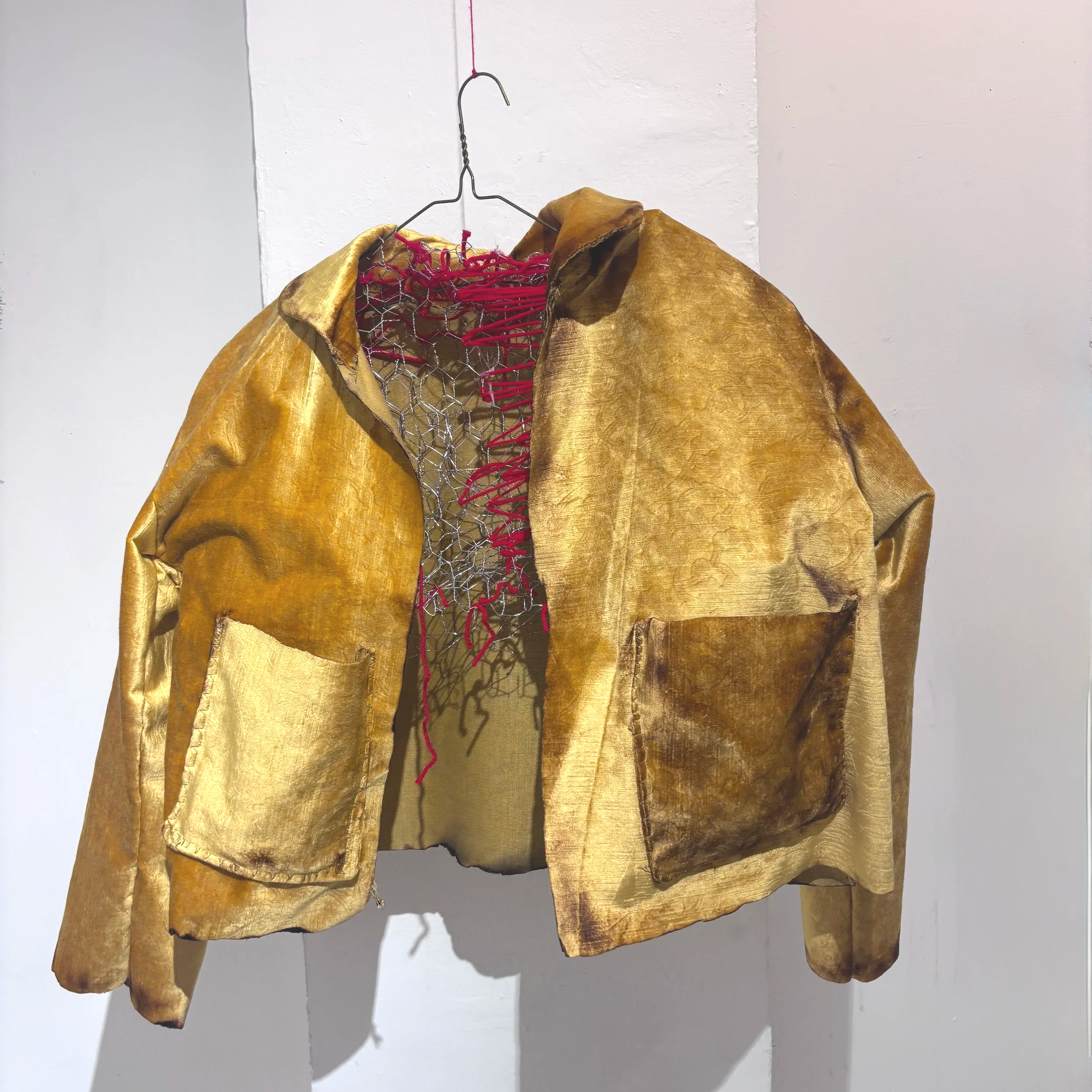 Coat of Grief No. 1 
Upcycled theater curtain, thread, yarn, chicken wire, DTG-printed fabric, and handwritten obituaries for past versions of myself that I've grieved, lighter
30 x 24 x 6 in
2026
