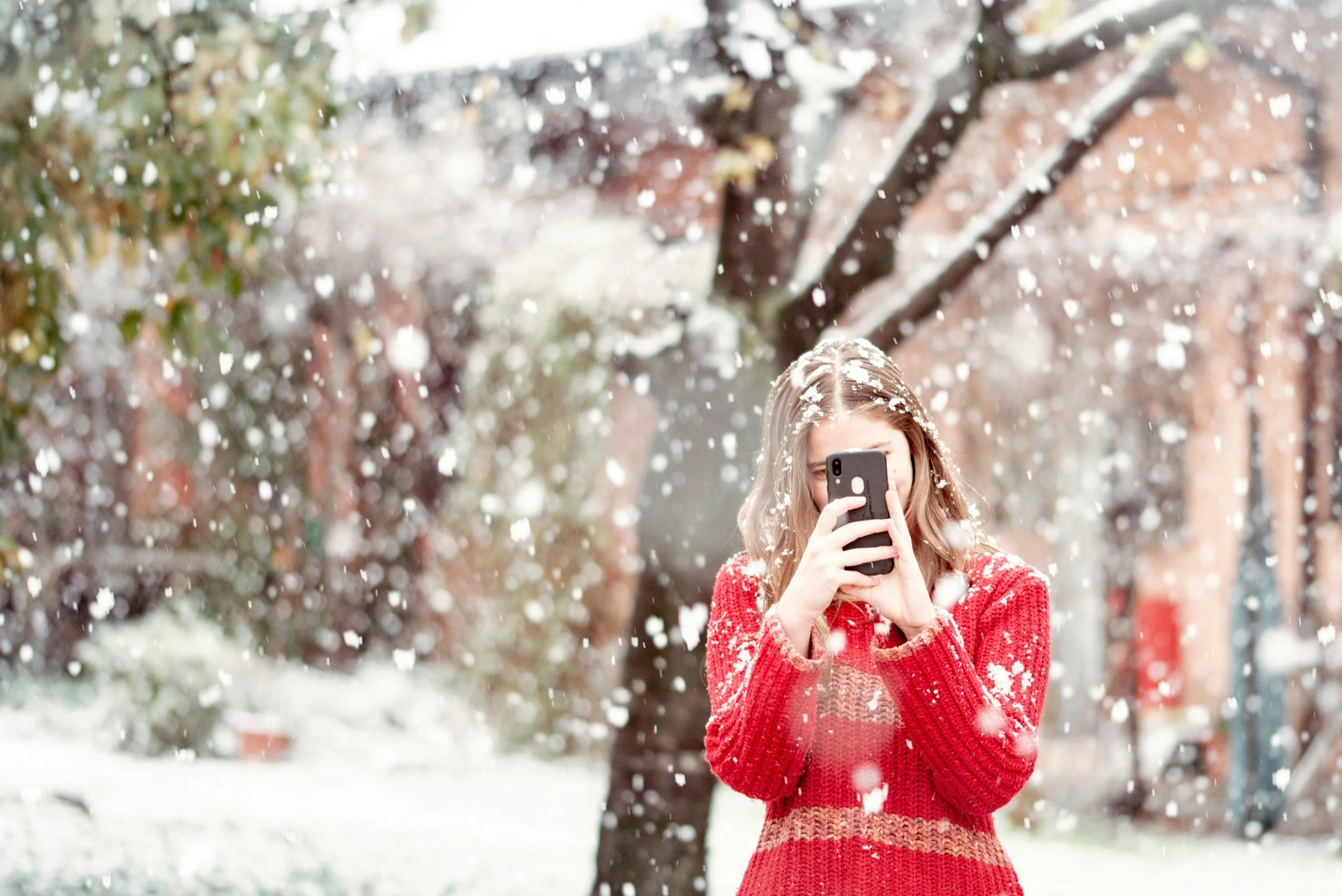 woman reflecting during winter, feeling overwhelmed in December, calm introspective moment, holiday anxiety support, EleVolve Wellness