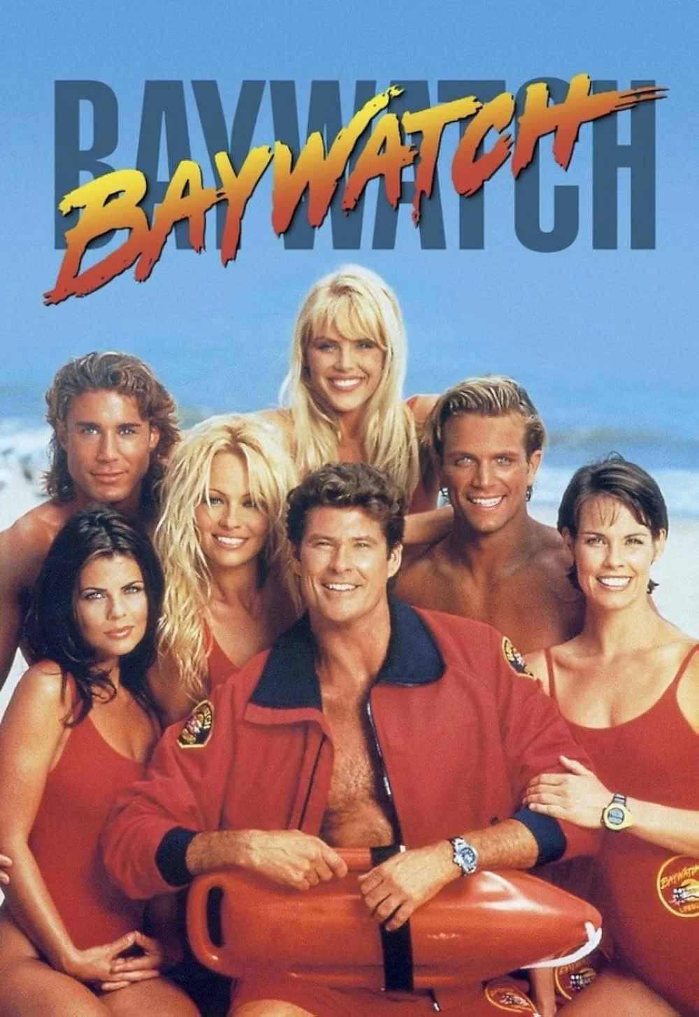 The iconic cast of the TV show 'Baywatch' posing on the beach, with the show's logo over the group.