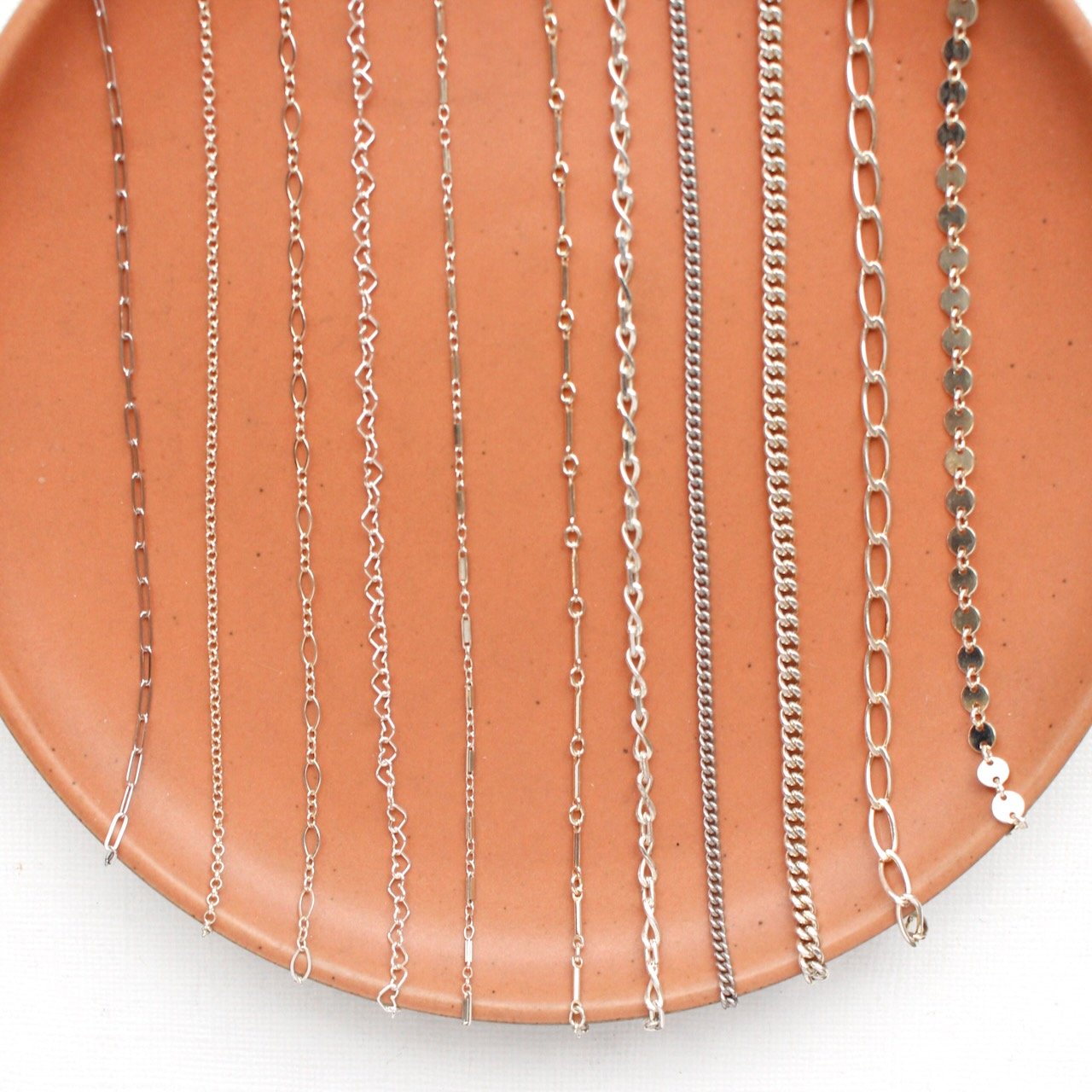 Examples of sterling silver chain options Infinite Permanent Jewelry offers at Adorne Artisan Jewelry & Goods