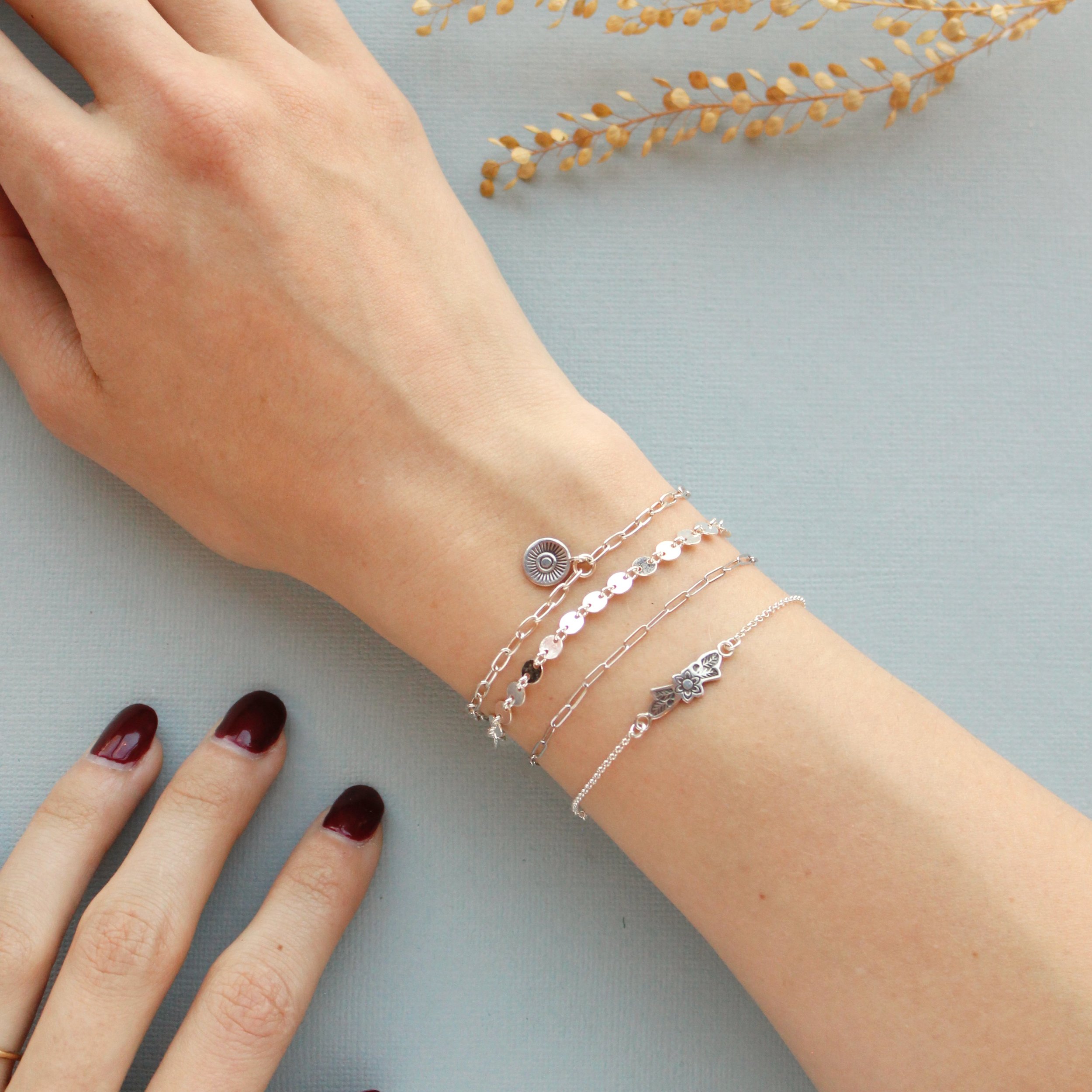 A few examples of sterling silver permanent jewelry bracelets from Infinite Permanent Jewelry