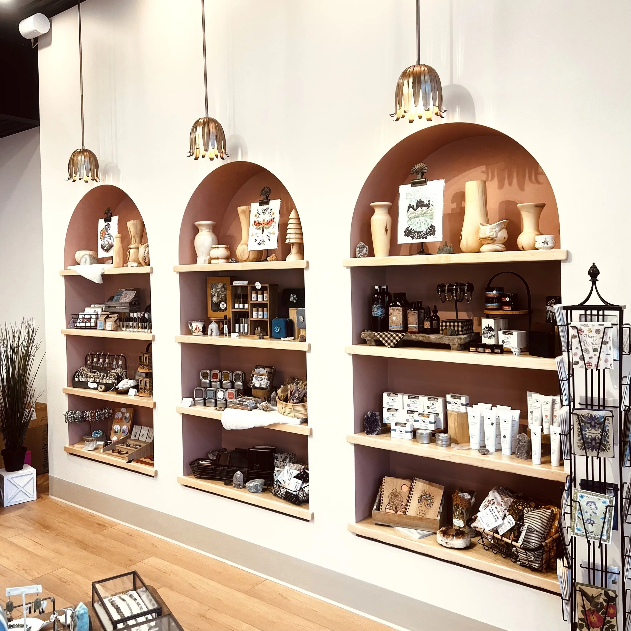 Shelves featuring artisan goods at Adorne