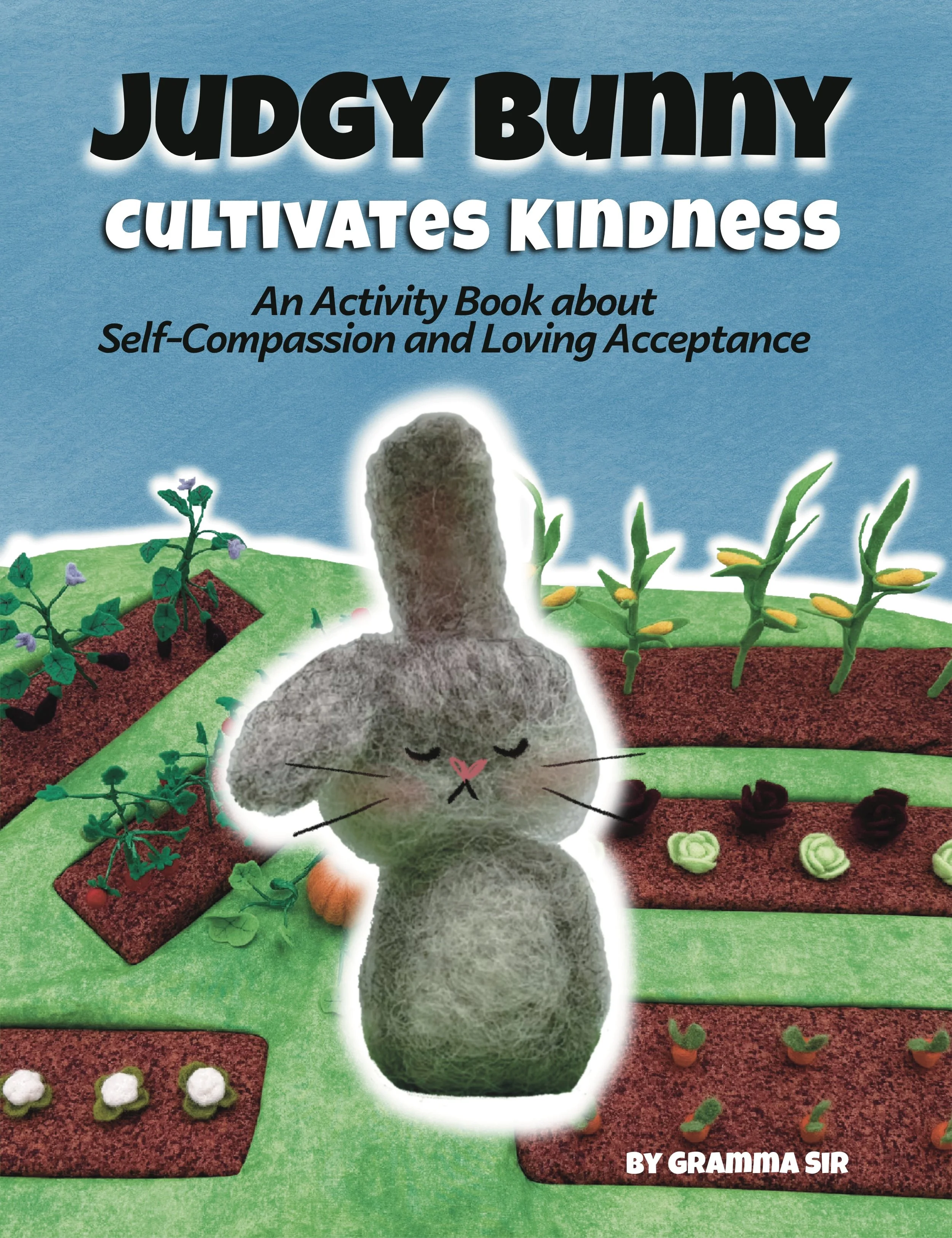 Judgy Bunny Cultivates Kindness. Needled felted garden and grey bunny rabbit from the picture book series Judgy Bunny.