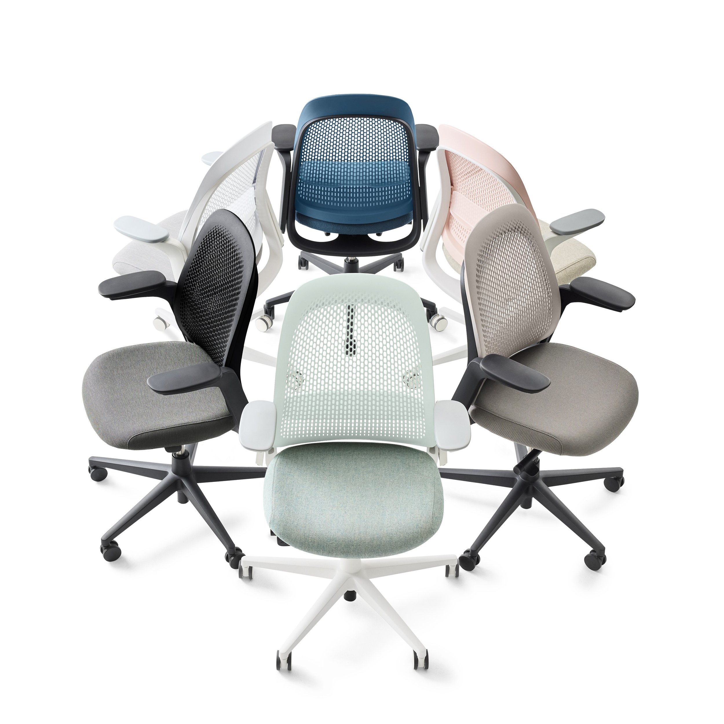 Six ergonomic office chairs in various colors arranged in a circle, viewed from above.