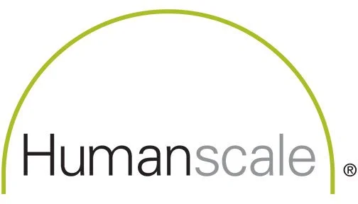 Logo of Human Scale with a green semi-circular line above the text.