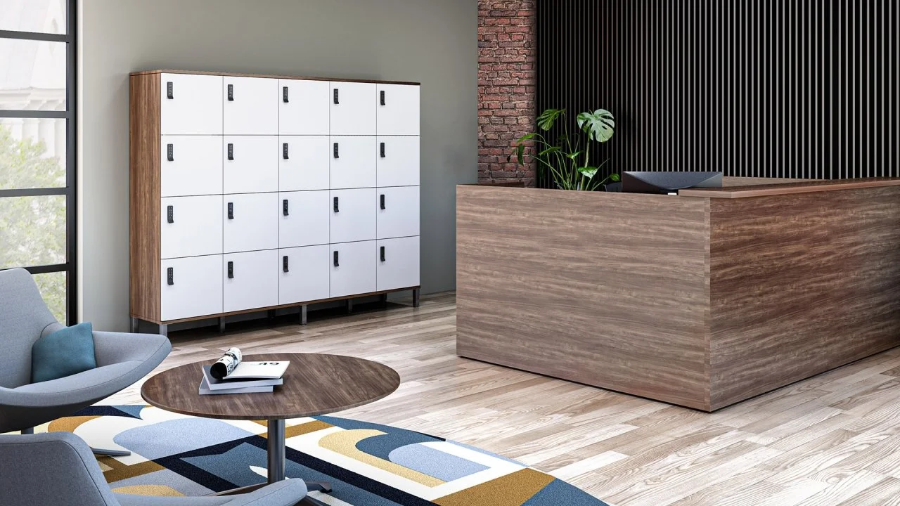 Modern reception area with wooden reception desk, plant, white lockers, and a cozy seating area with a rug and chairs.