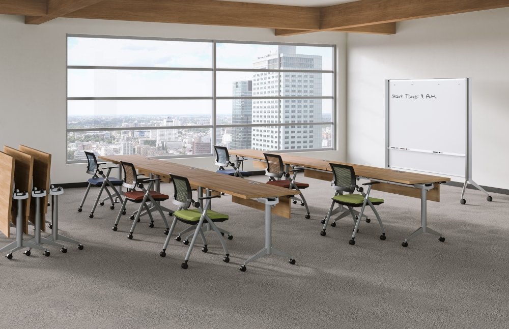 Empty modern conference room with large windows overlooking a cityscape, with tables and chairs arranged, a whiteboard, and a wooden ceiling.
