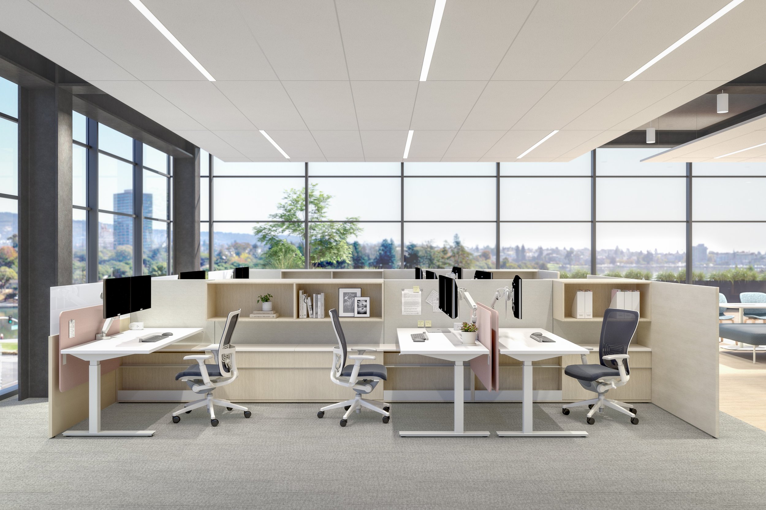 Modern office workspace with multiple desks, ergonomic chairs, and desktop computers, set in a bright room with large floor-to-ceiling windows and city view.