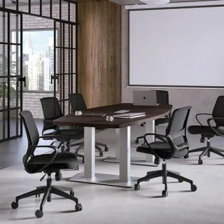 Empty conference room with a wooden wall, large window, whiteboard, and six black office chairs around a rectangular table.