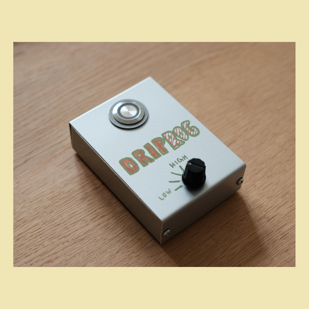 A photo of the DripRog field recorder on a wooden surface.