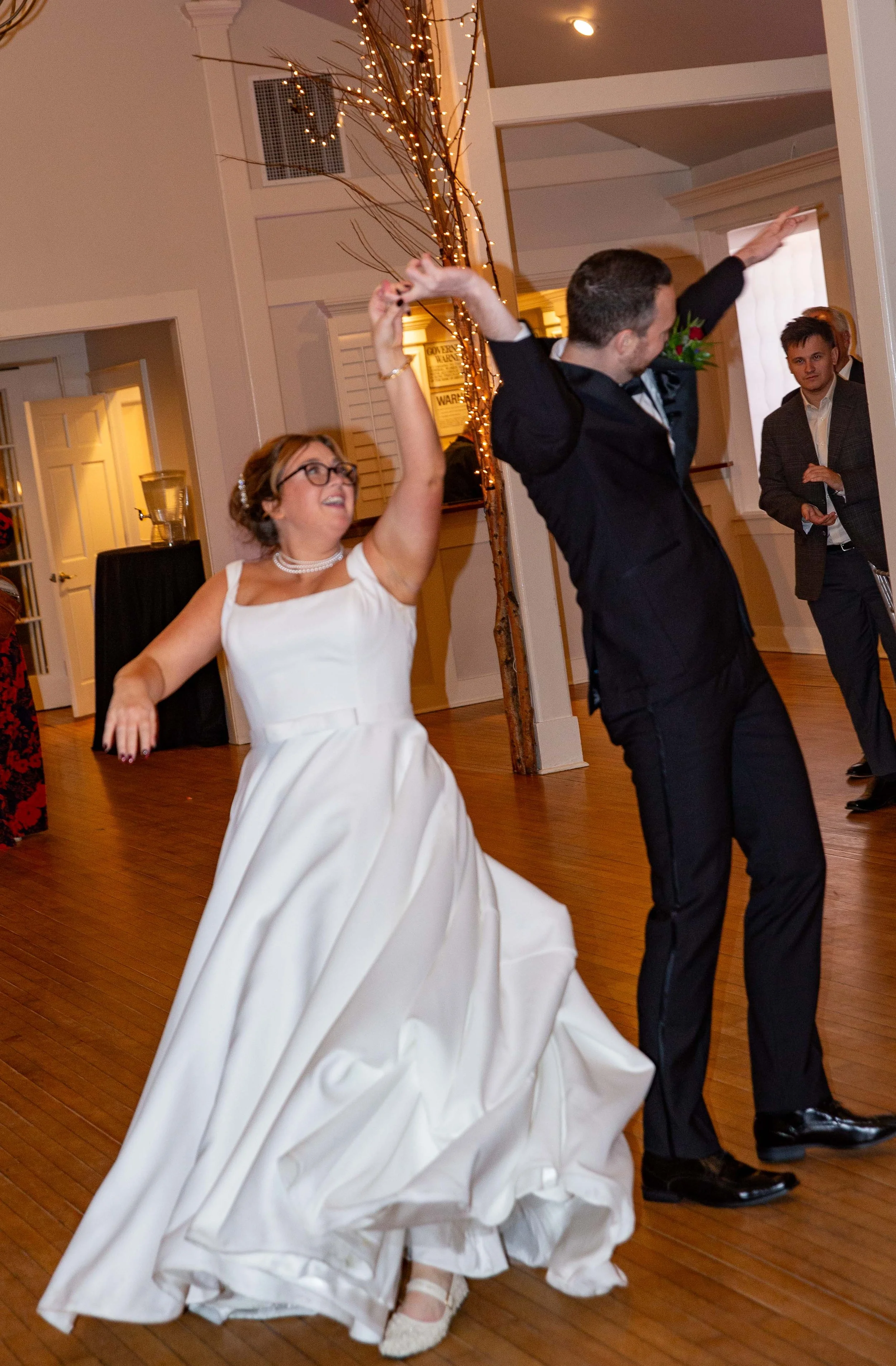 A bride and groom dancing at their wedding reception.