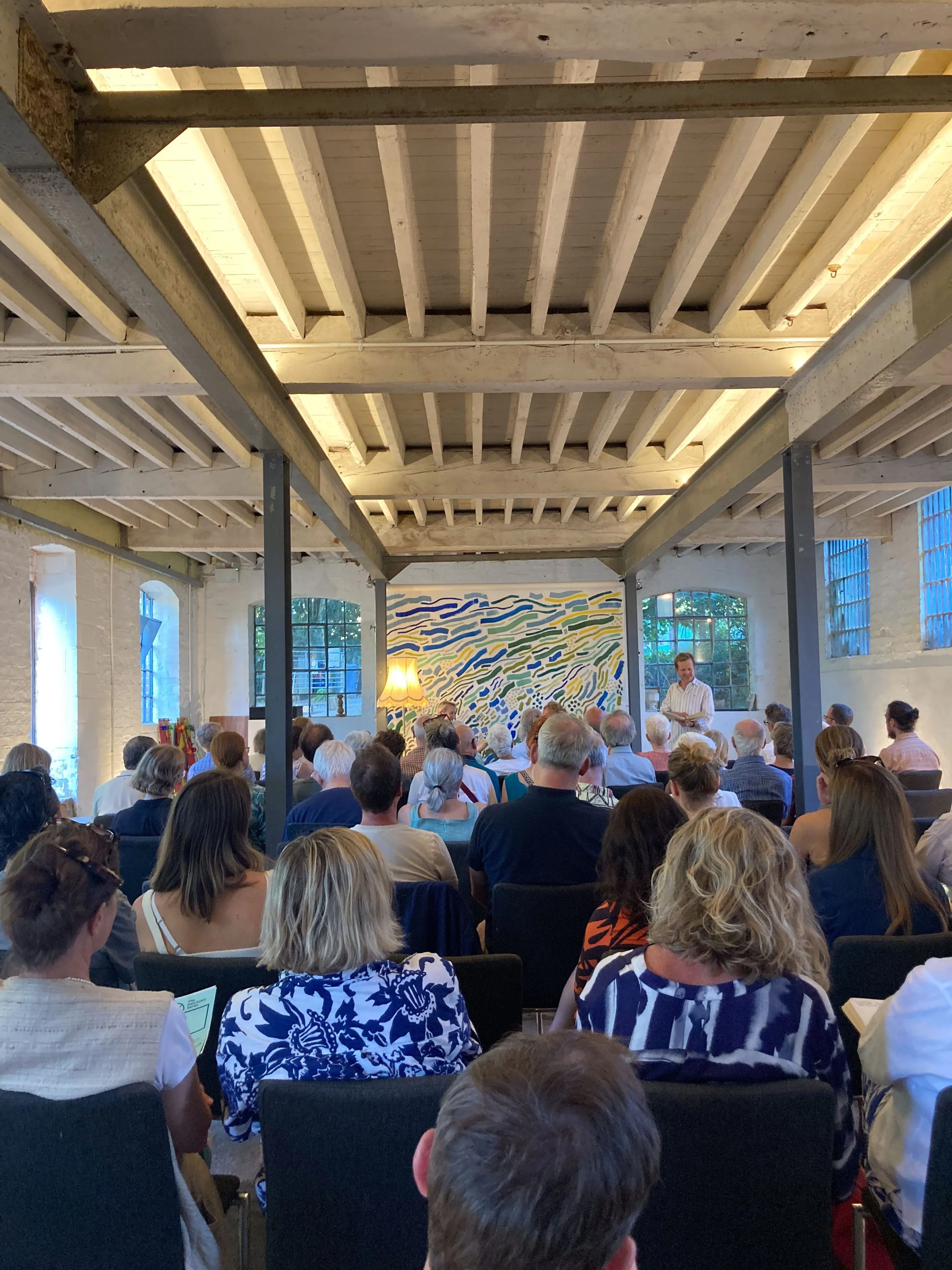 Juliet Davenport ( former CEO of Good Energy ) and Emma Pinchbeck (CEO at the Climate Change Committee), shared insights on the future of energy and climate action. The backdrop depicted large and small actions collectively leading forwards.