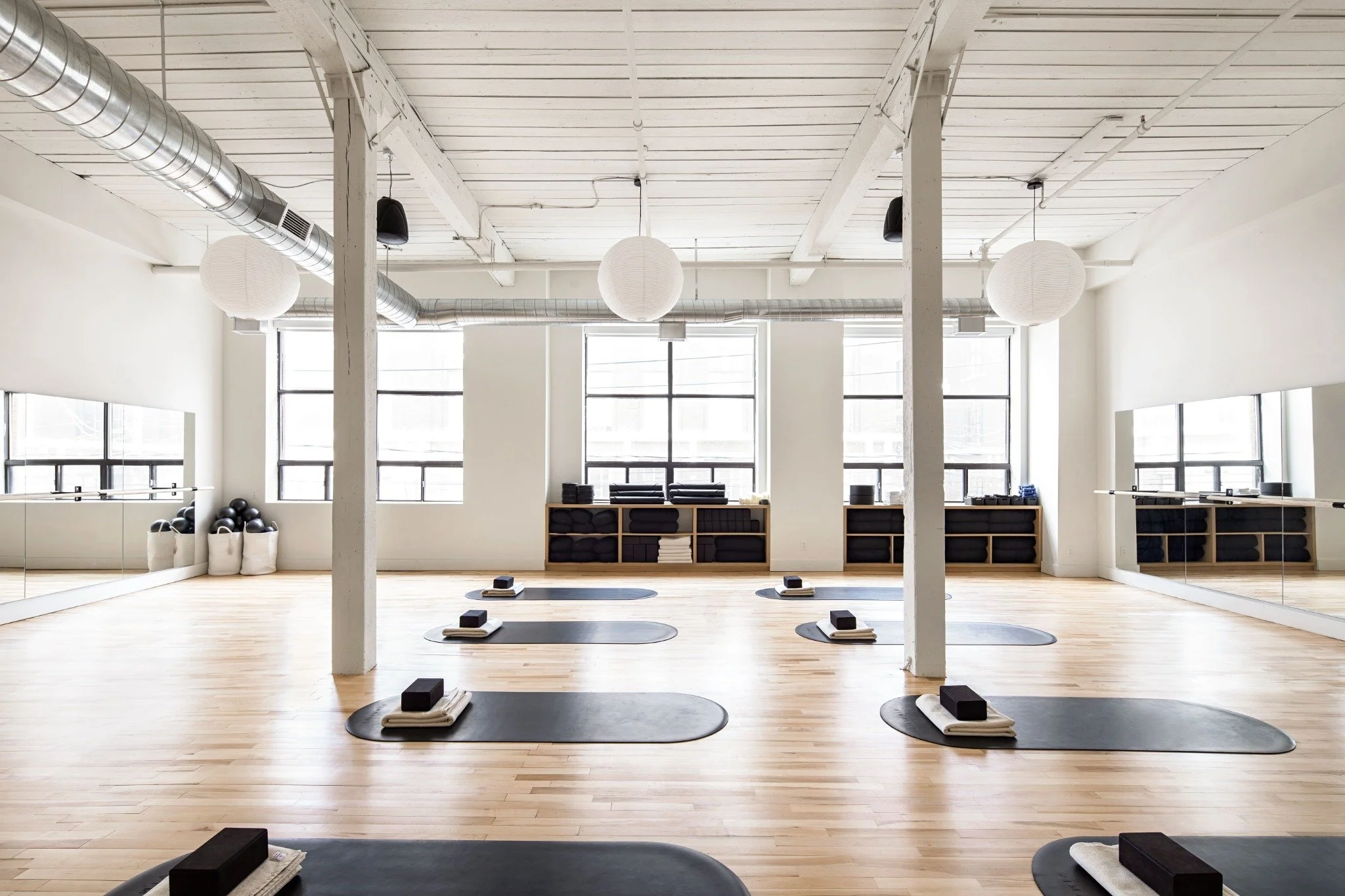 Bright VIMALIFE yoga studio in Leslieville with mats, blocks and natural light for group fitness classes.