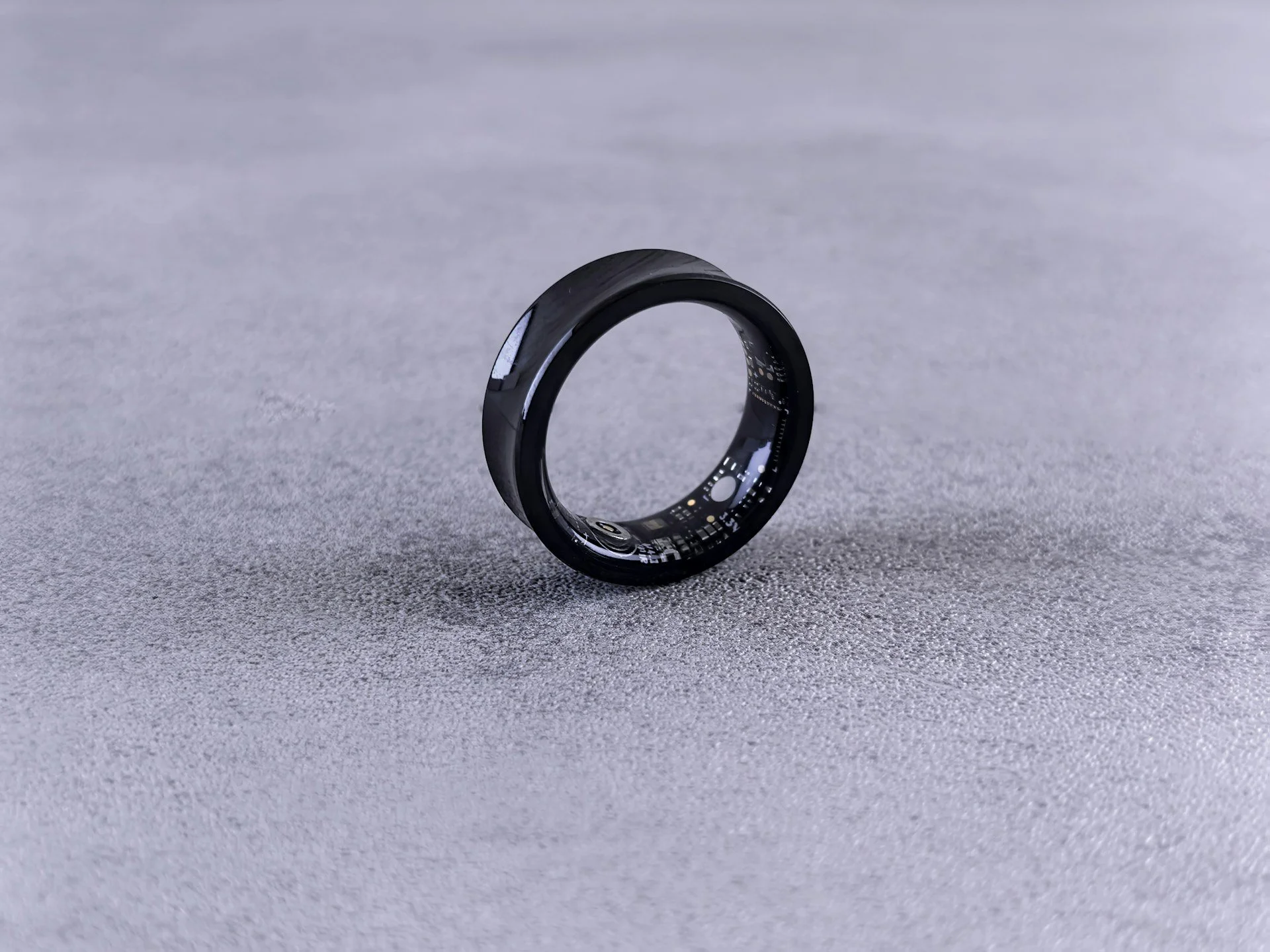 Black smart ring used to track sleep, recovery and other health metrics.