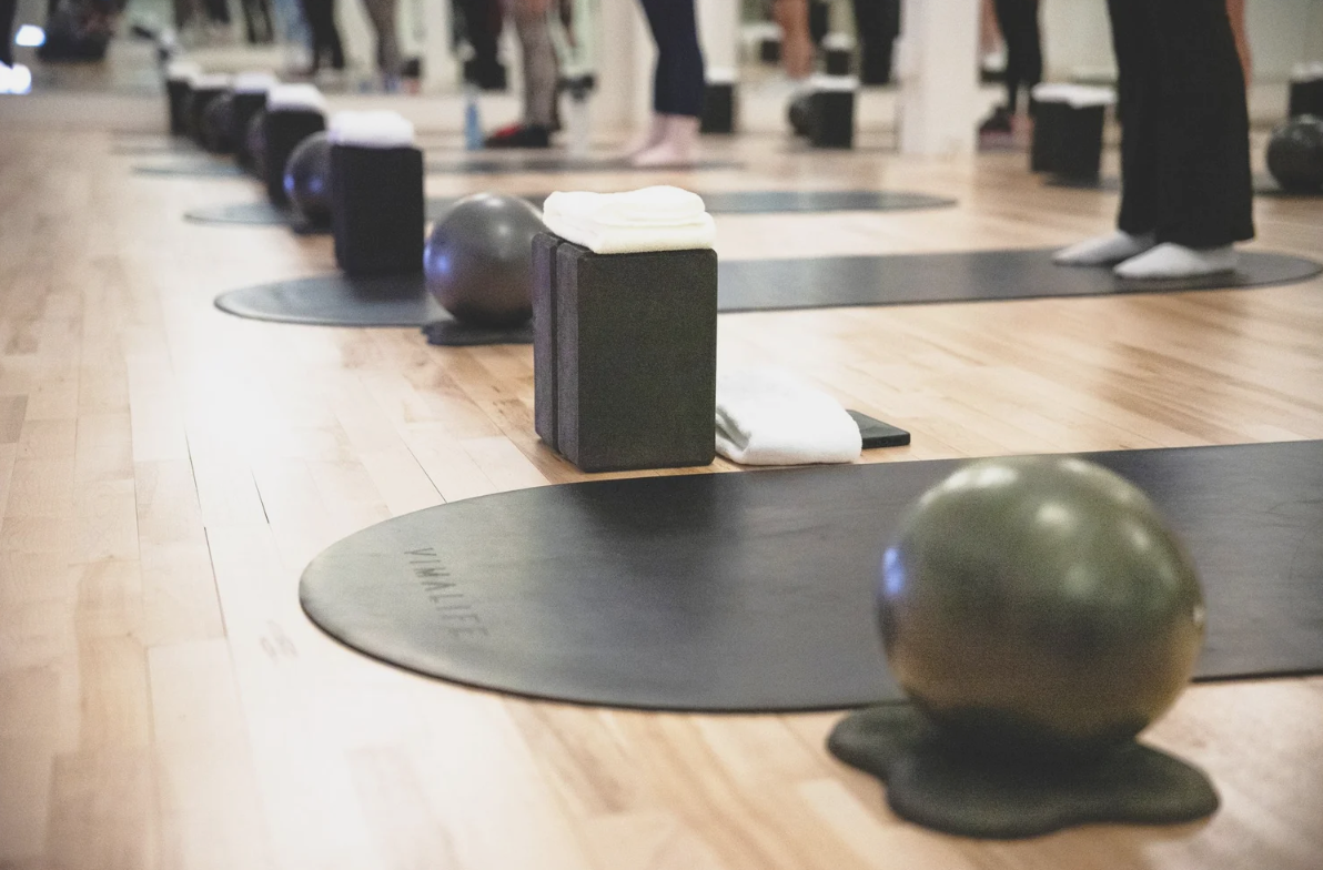 Pilates mats, props and exercise balls set up for a VIMALIFE class in the VIMAZEN studio in Leslieville, Toronto.