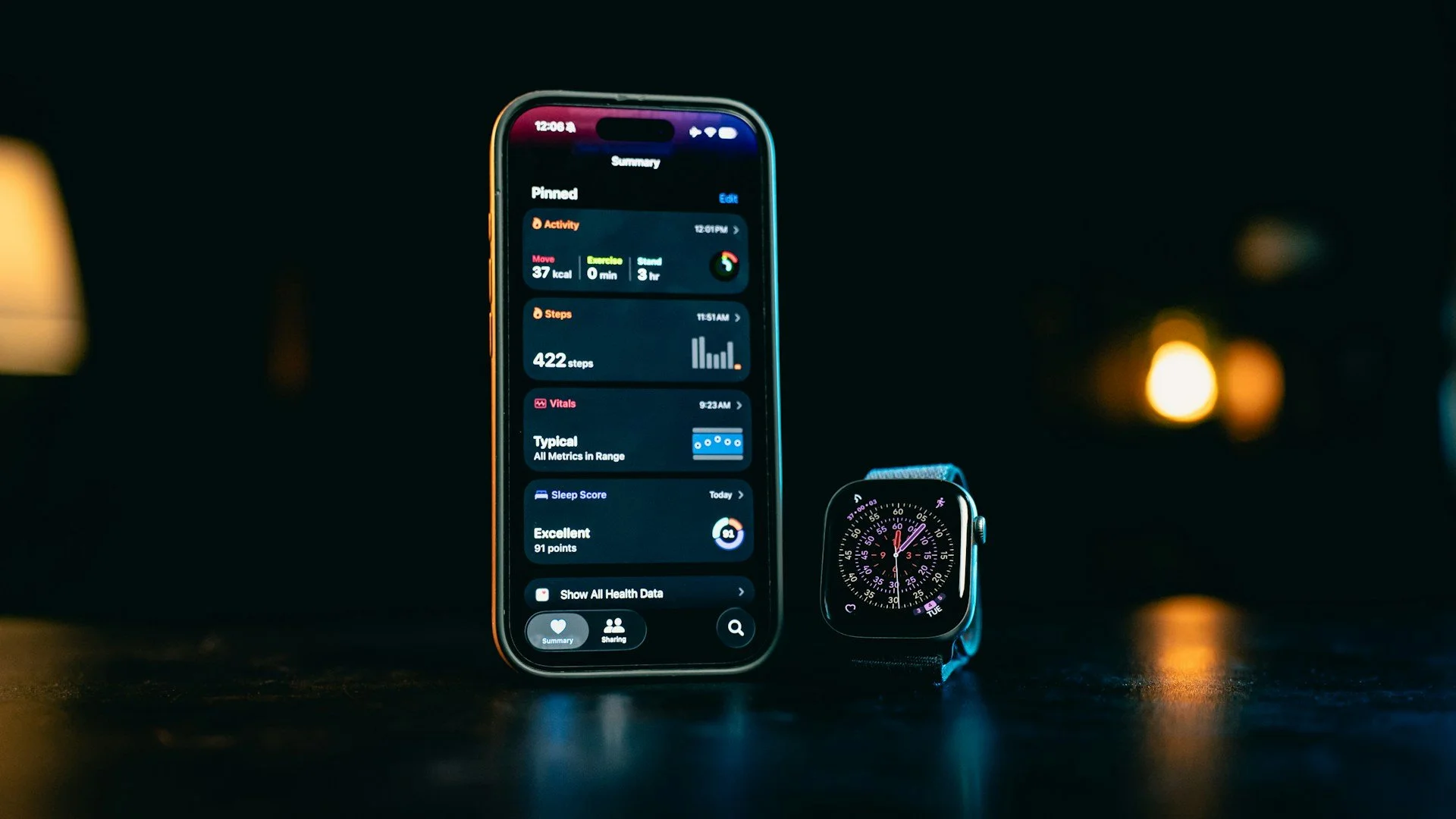 Smartphone and smartwatch displaying activity, step, vital and sleep-tracking data.