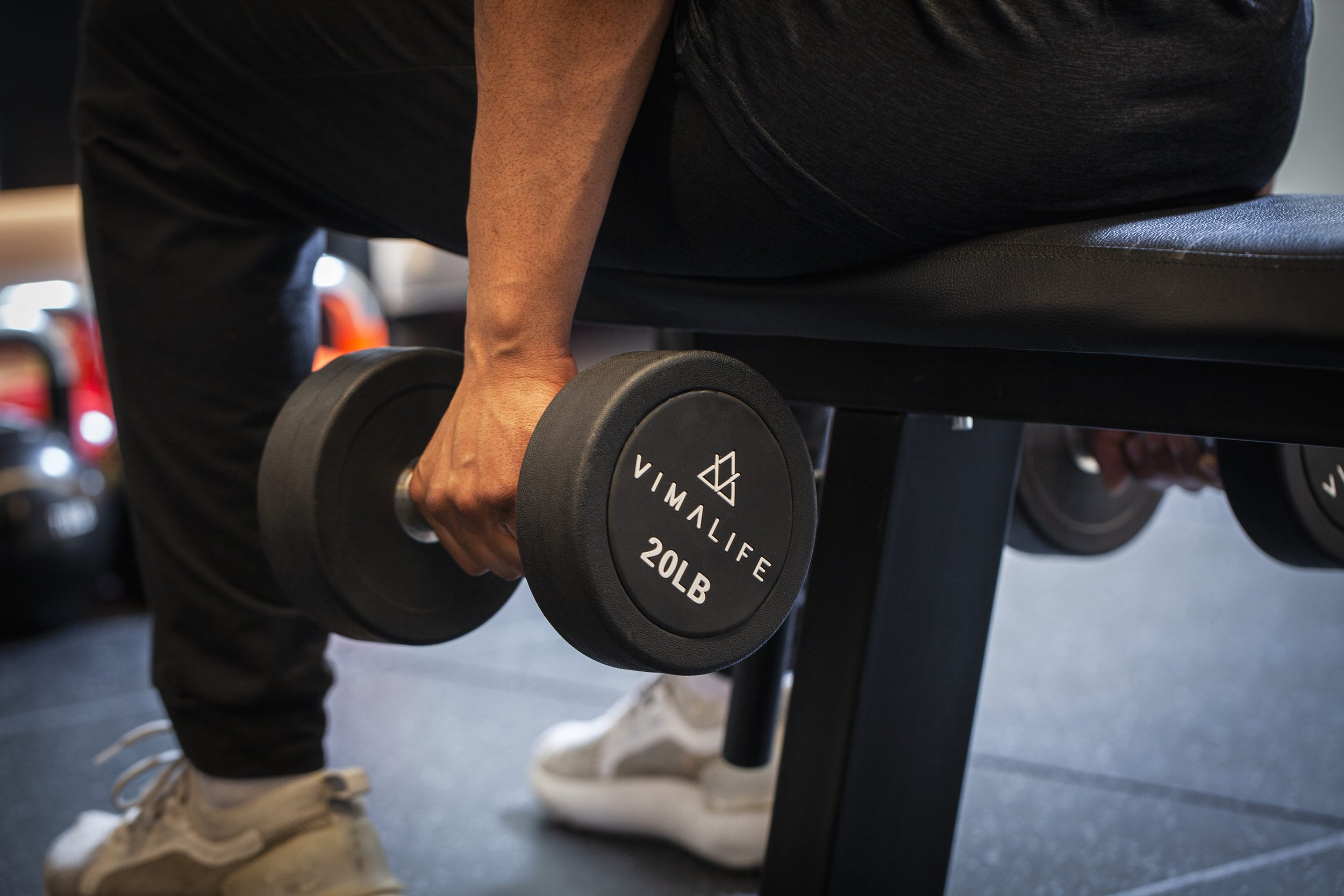 Close-up of a VIMALIFE dumbbell used for strength training at a boutique gym in Leslieville, Toronto.