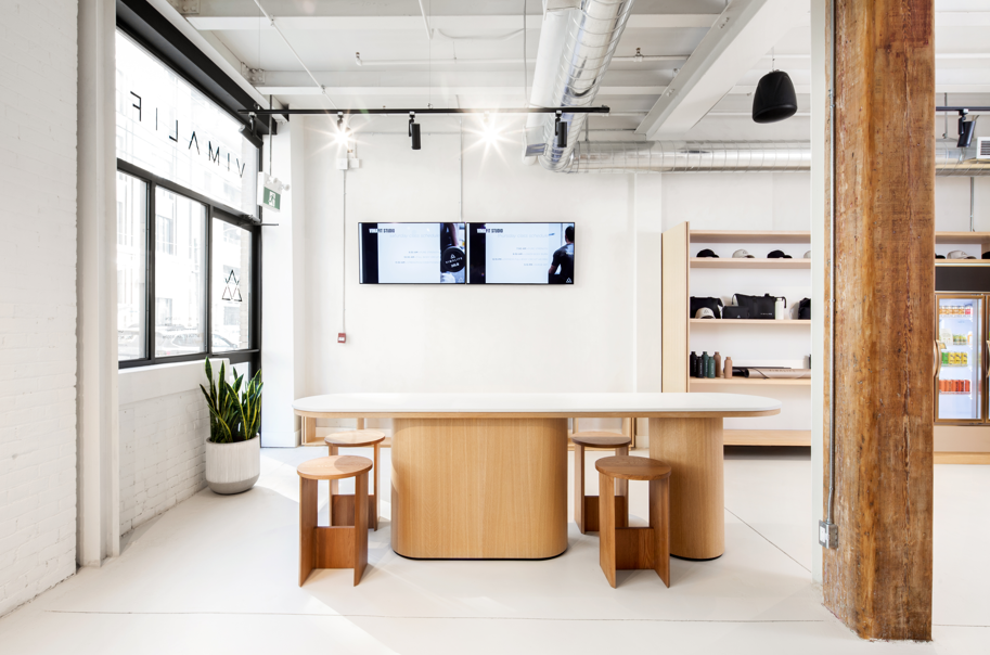 VIMALIFE reception and member lounge inside a bright boutique fitness and wellness club in Leslieville, Toronto.
