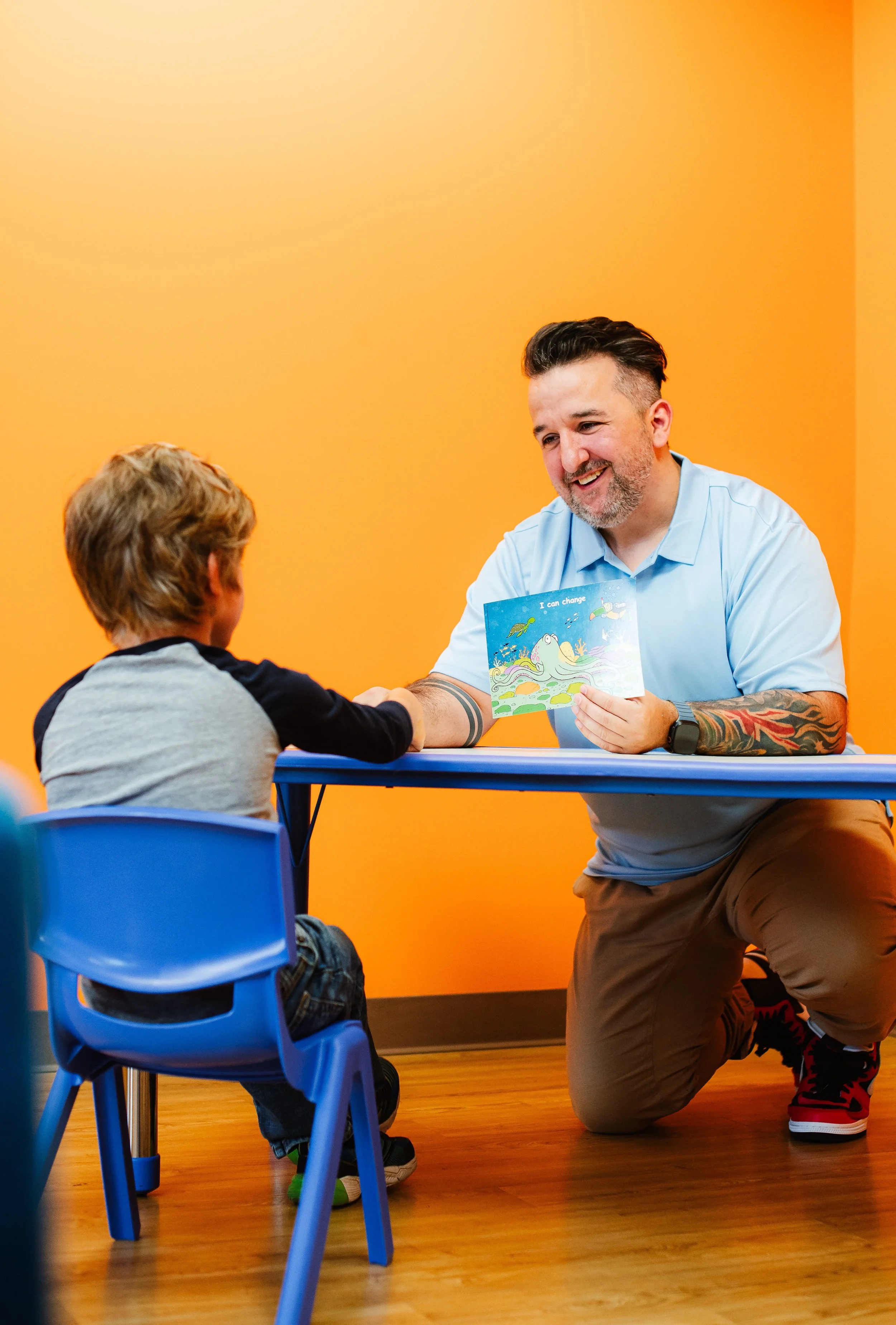Child and counsellor working together during kids counselling session