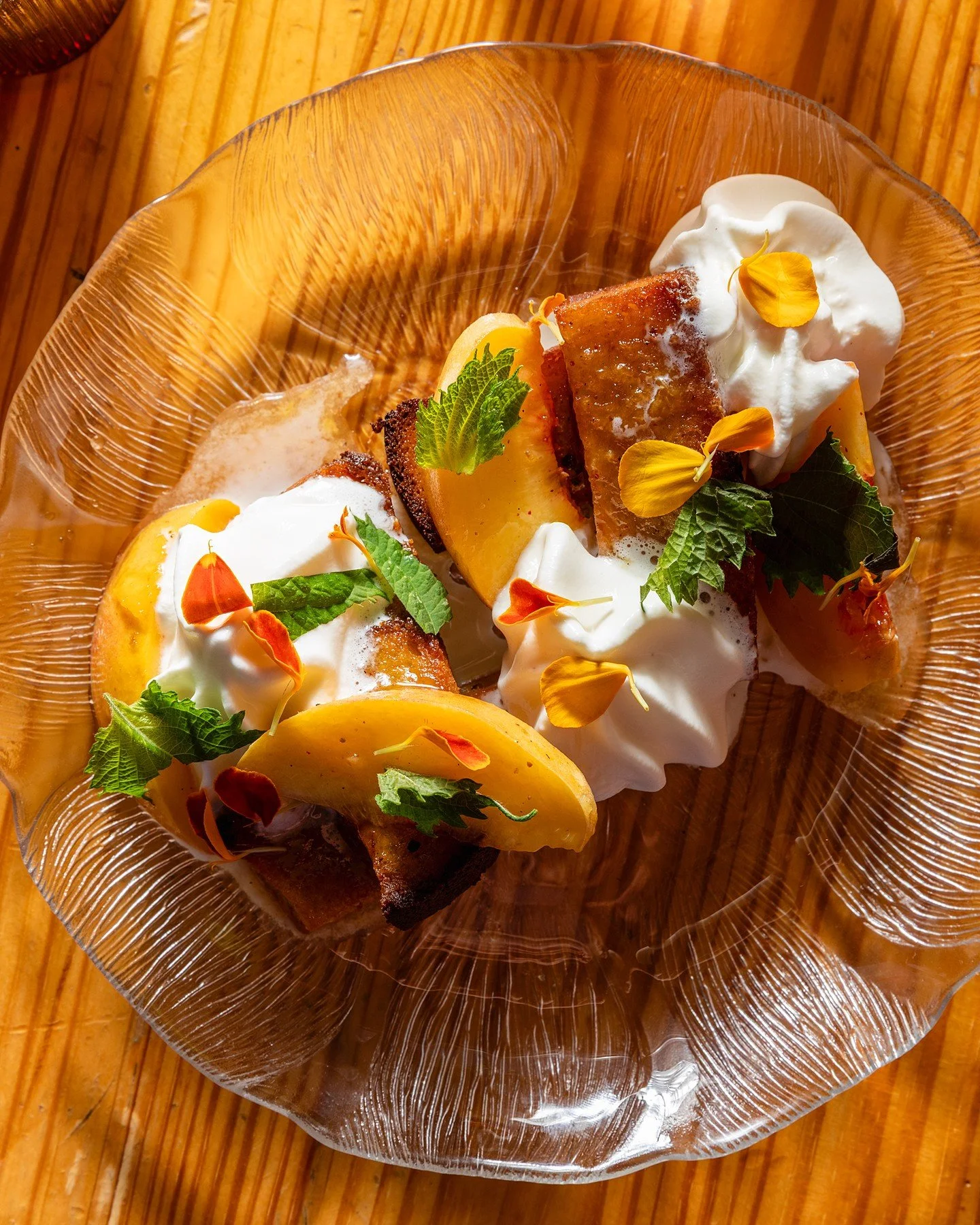 🍑 Peach Mochi Cake just dropped and it's a vibe and a half. Chewy mochi base, bay leaf chantilly, marinated Michigan peaches, shiso. Sweet, herbaceous, and exactly what your dessert situation needs right now. Get down here before we run out of peach