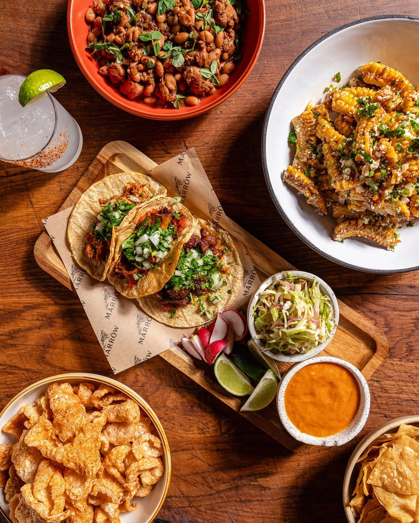 💥 Taco Tuesday is THIS TUESDAY and we need to talk about what Karen's got lined up because this is a FULL dinner situation.

SNACKS
Fresh chips with salsa trio (verde, tatemada, taquera), pork rinds with dry chili spice and candied nuts, plus corn r