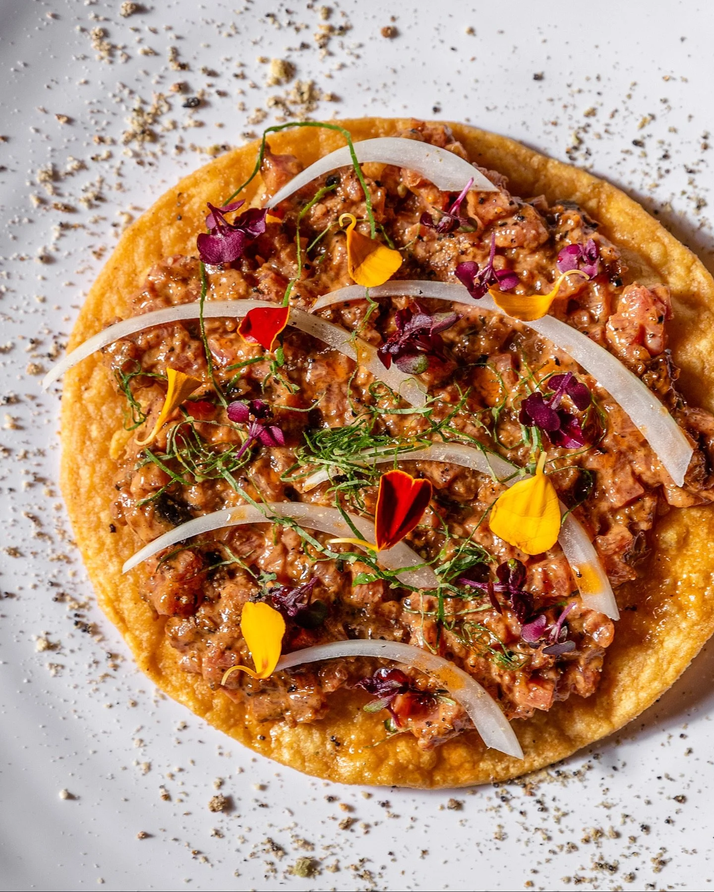 👀 Y&rsquo;ALL &gt;&gt; the new tasting menu just rolled out and the first course is hitting different. Sure, we say five courses on the menu, but this snacks round is a bonus right out of the gate with three different bites: 

&bull; Raw Beef Tostad