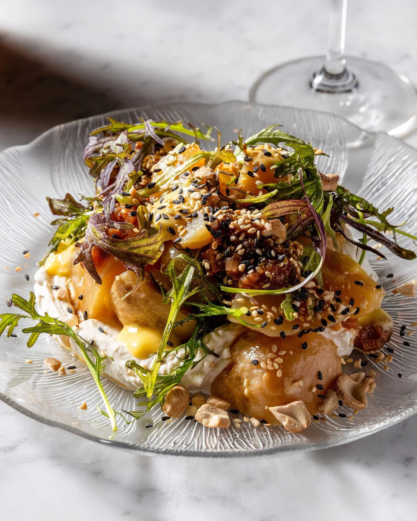 Salt roasted beets, doing the most. Tahini labneh, black lime curd for a zesty punch, and a rhubarb ezme.

Ezme, a condiment with Turkish roots, is usually built on raw peppers, tomato, herbs, all chopped fine and bright. Chef Eddie kept the bones of