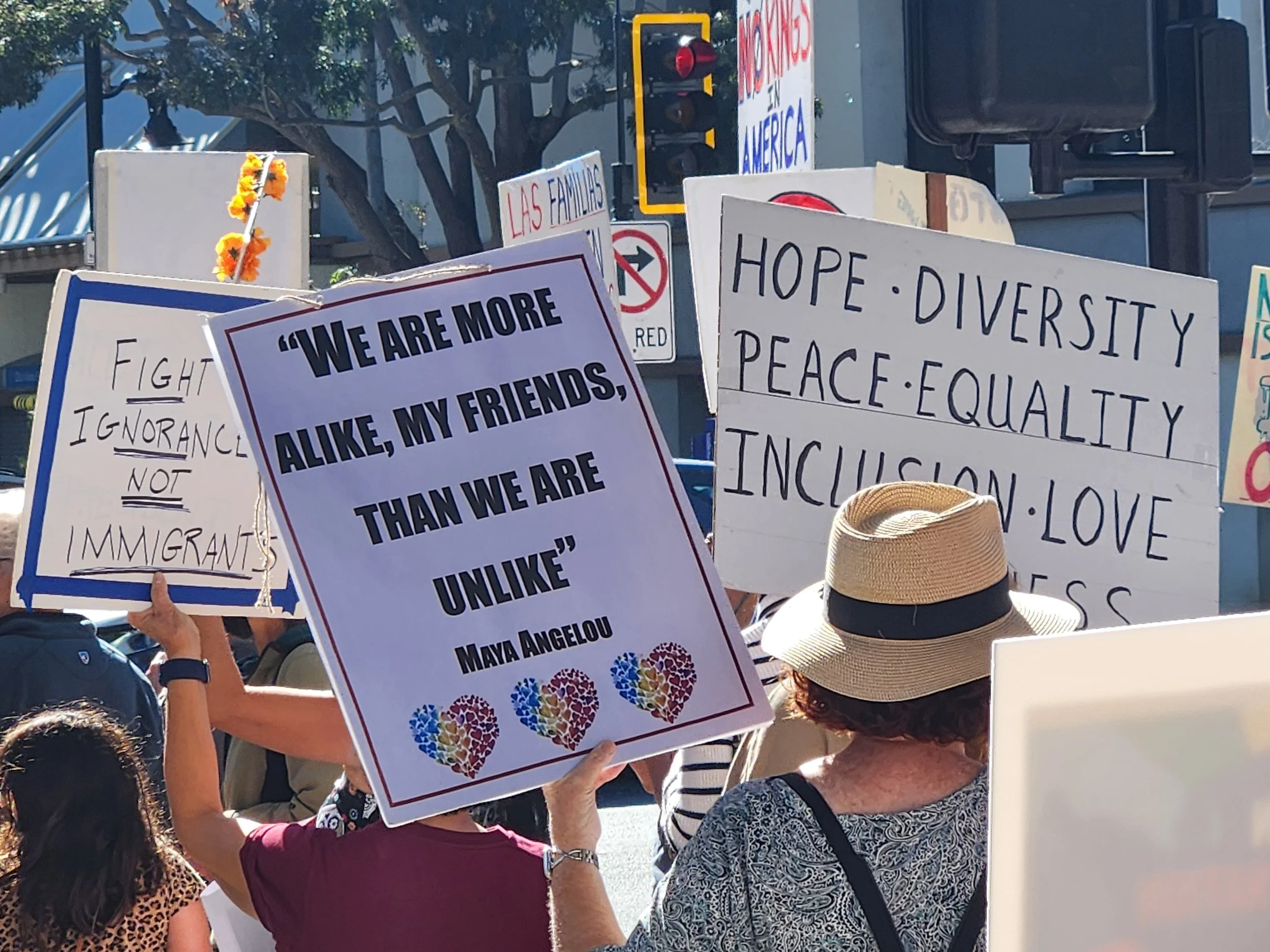 Protesters with signs, crowded together.