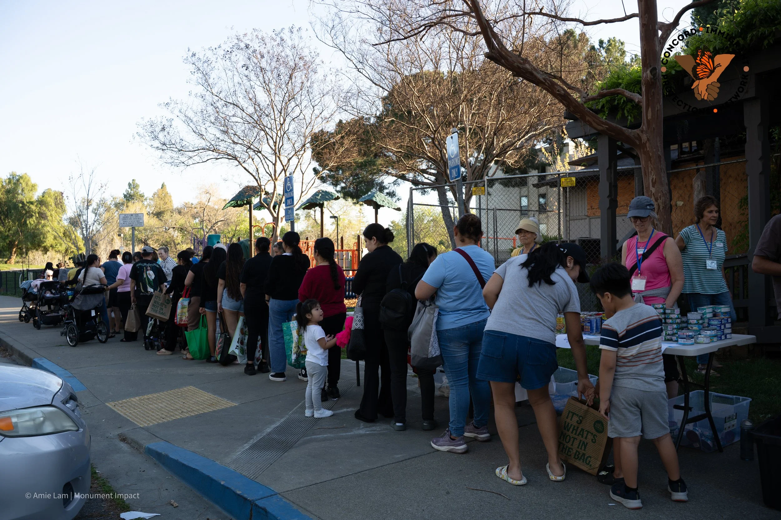 Families wait in line at the Food Pantry.