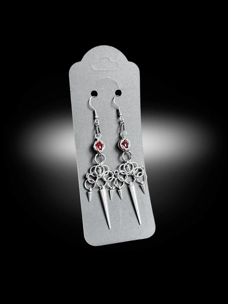 Warlord earrings close-up showing chainmail detail and red bead accents